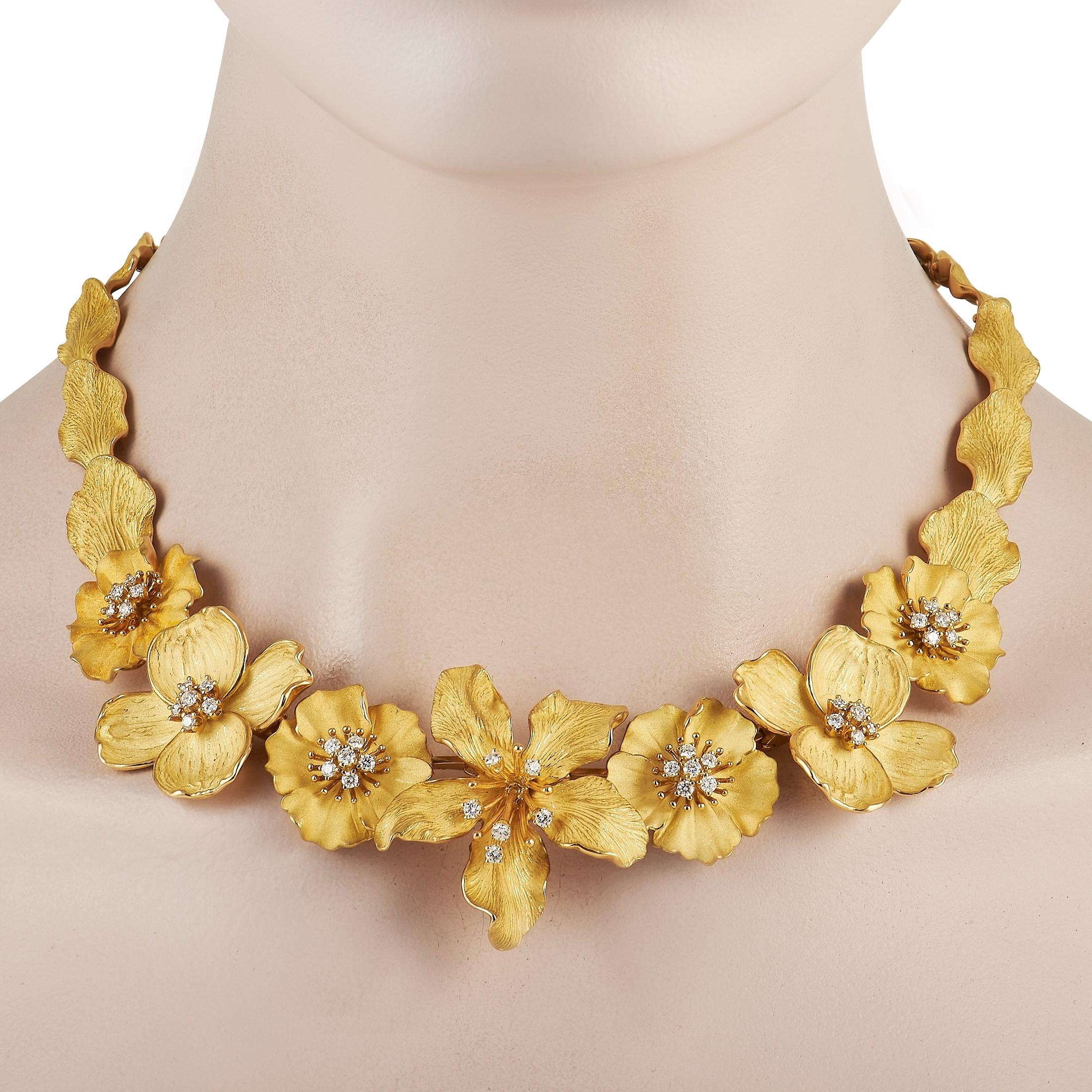 Delicate yet bold, this exquisite yellow gold necklace from Tiffany & Co.'s Dogwood Collection can instantly jazz up any look. The 17-inch long necklace features a series of sculpted and textured floral and foliage motifs. The central set of seven