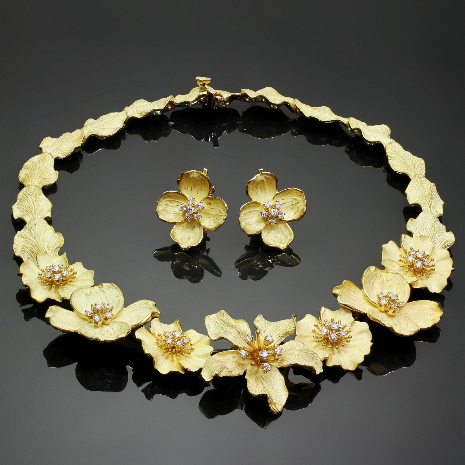This exquisite Tiffany & Co. jewelry set from the delicate floral Dogwood collection features an evening necklace with a matching pair of earrings crafted in 18k yellow gold and accented with sparkling brilliant-cut round F-G VVS2-VS1 diamonds. The