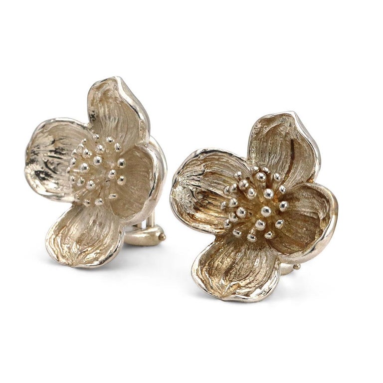 Authentic Tiffany & Co. Vintage Dogwood Flower Earrings crafted in sterling silver. These timeless earrings are designed as a pair of flowers and features an omega back closure. Signed T&Co., 925. The earrings are not presented with the original box