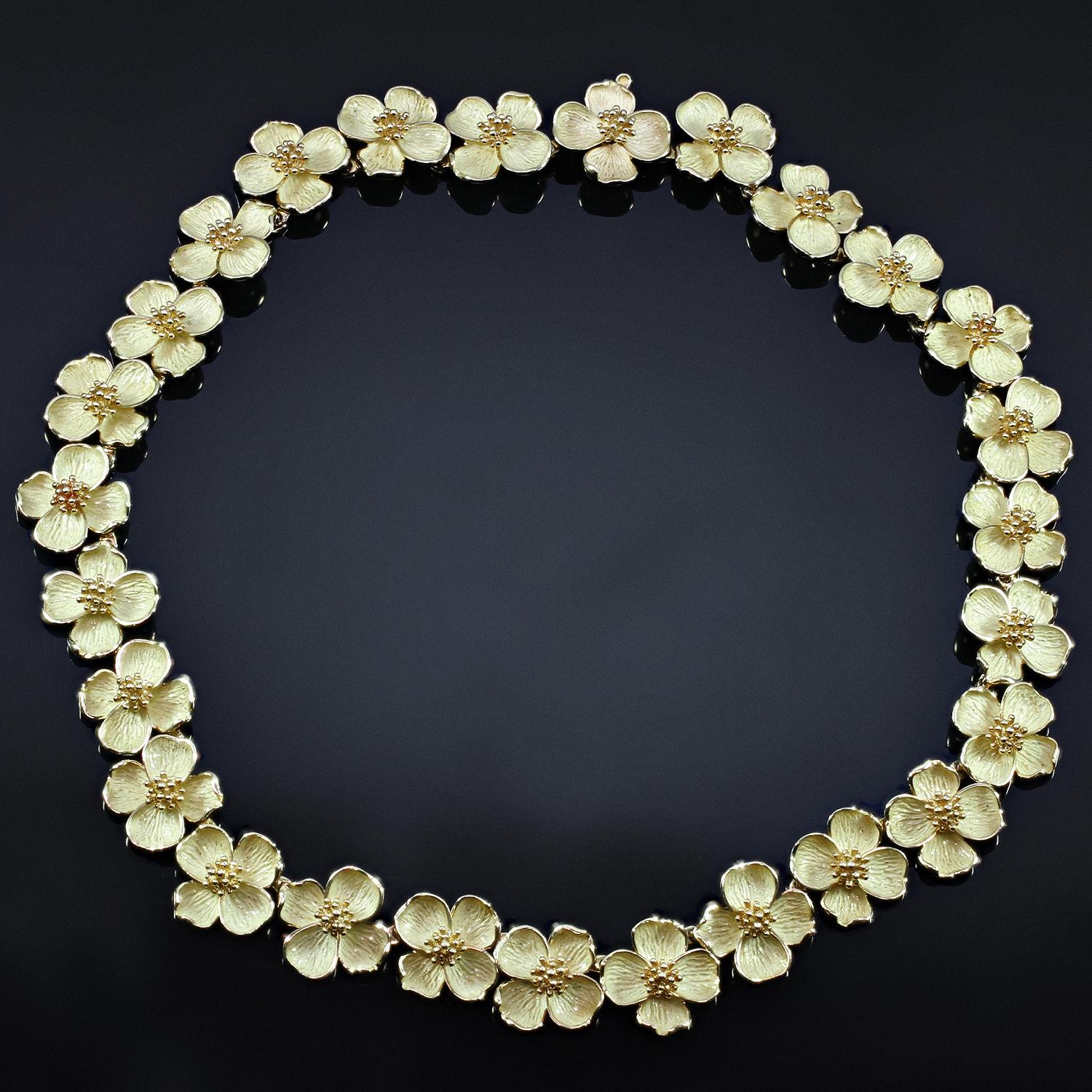 This rare Tiffany & Co. necklace features links of delicate Dogwood flowers crafted in 18k yellow gold with high polish and matte finishes.  Made in United Kingdom circa 1980s. Measurements: 0.70