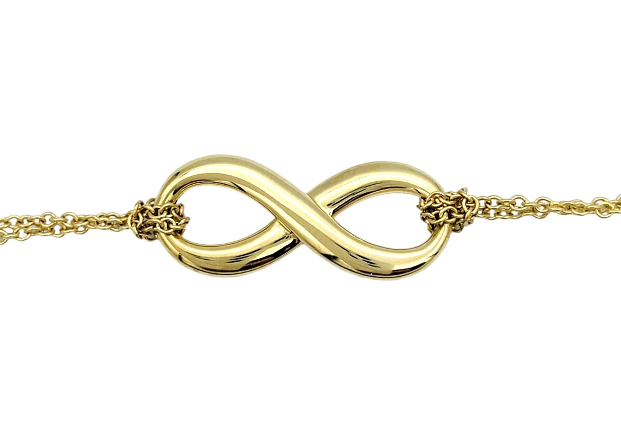 Contemporary Tiffany & Co. Double Chain Infinity Pendant Necklace Set in 18 Karat Yellow Gold For Sale