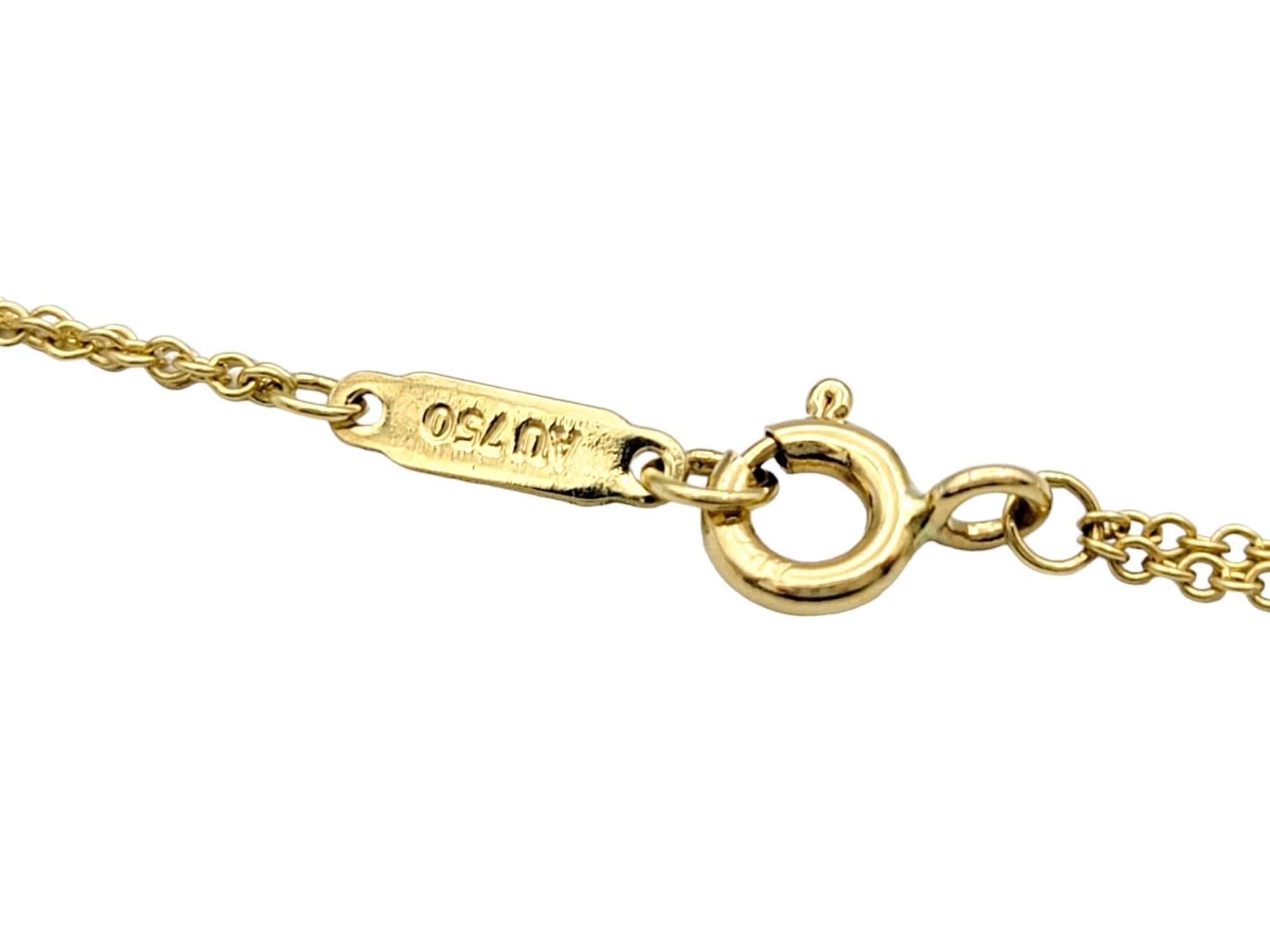 Tiffany & Co. Collier pendentif Infinity à double chaîne en or jaune 18 carats Pour femmes en vente