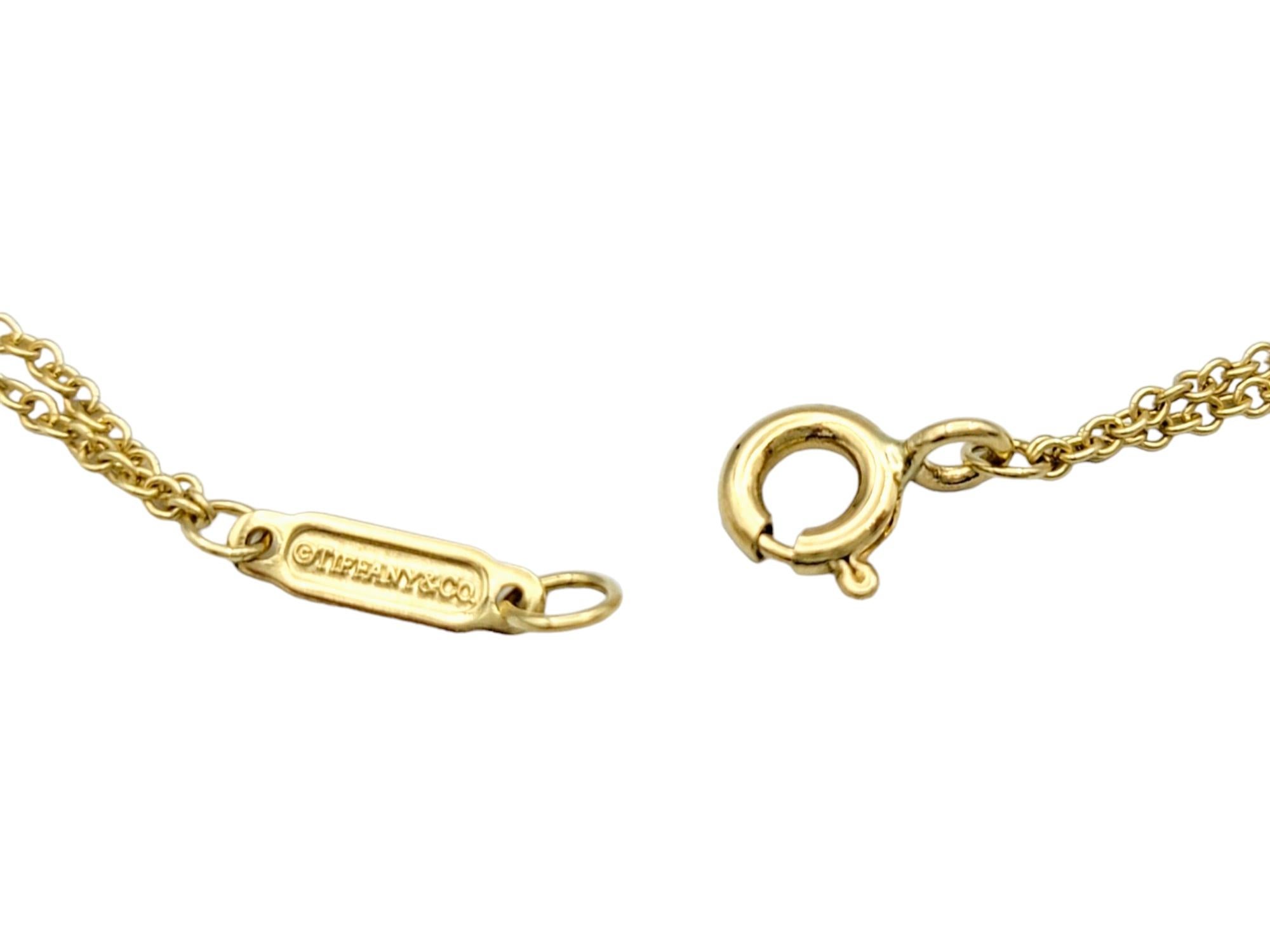 Tiffany & Co. Collier pendentif Infinity à double chaîne en or jaune 18 carats en vente 1