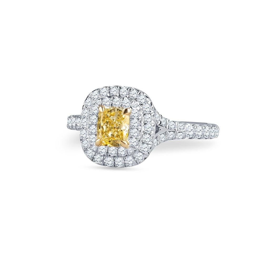 Tiffany & Co. Diamond engagement ring with 0.51ctw modified brilliant cushion fancy intense yellow center stone. Double halo with 0.49 carat total weight in round side stones. Ring size 4.5, size may be adjusted larger or smaller upon request.