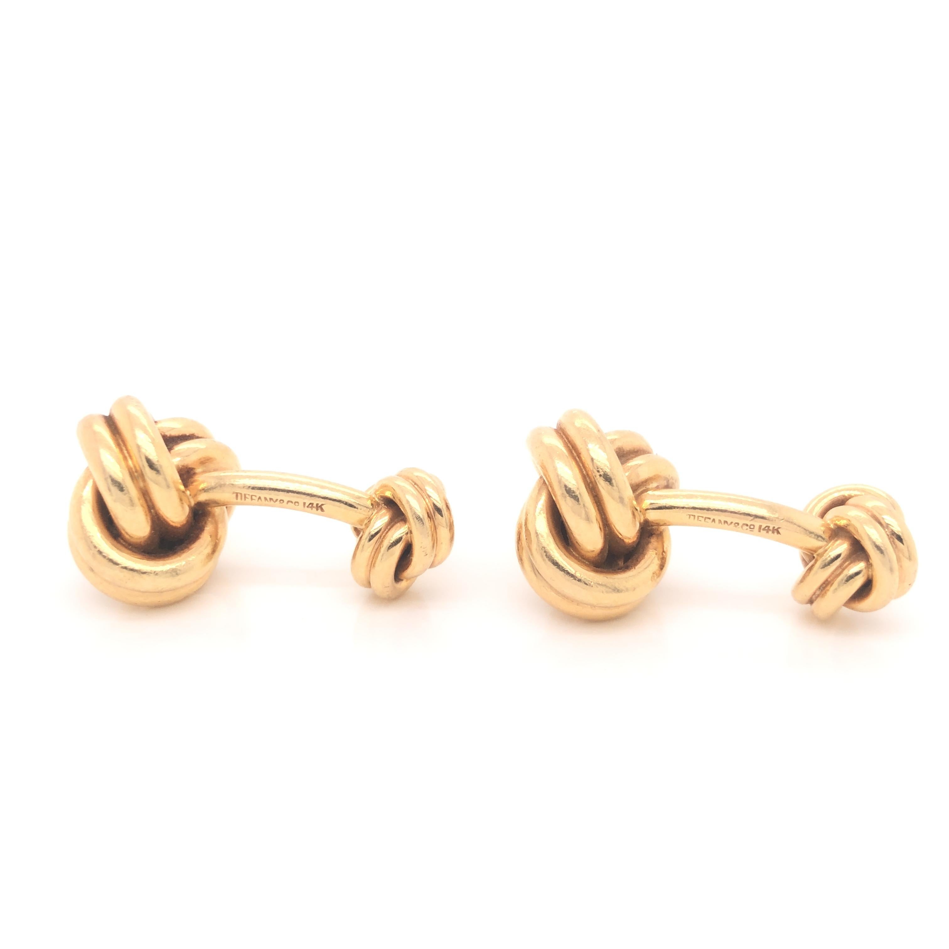 Tiffany & Co. Knot Cufflinks
Vintage Tiffany & Co. 14K yellow classic double sided love knot cufflinks.
Approximate Measurements: Length: 1.1
