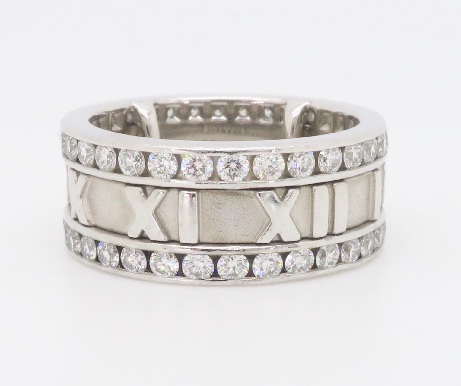 Iconic Tiffany & Co. Atlas diamond eternity band made in 18k White Gold with comfort fit bars that were added by Tiffany & Co. in excellent condition. 

Diamond Carat Weight: 1.92CTW
Diamond Cut: Round Brilliant
Color: Average E-F
Clarity: Average