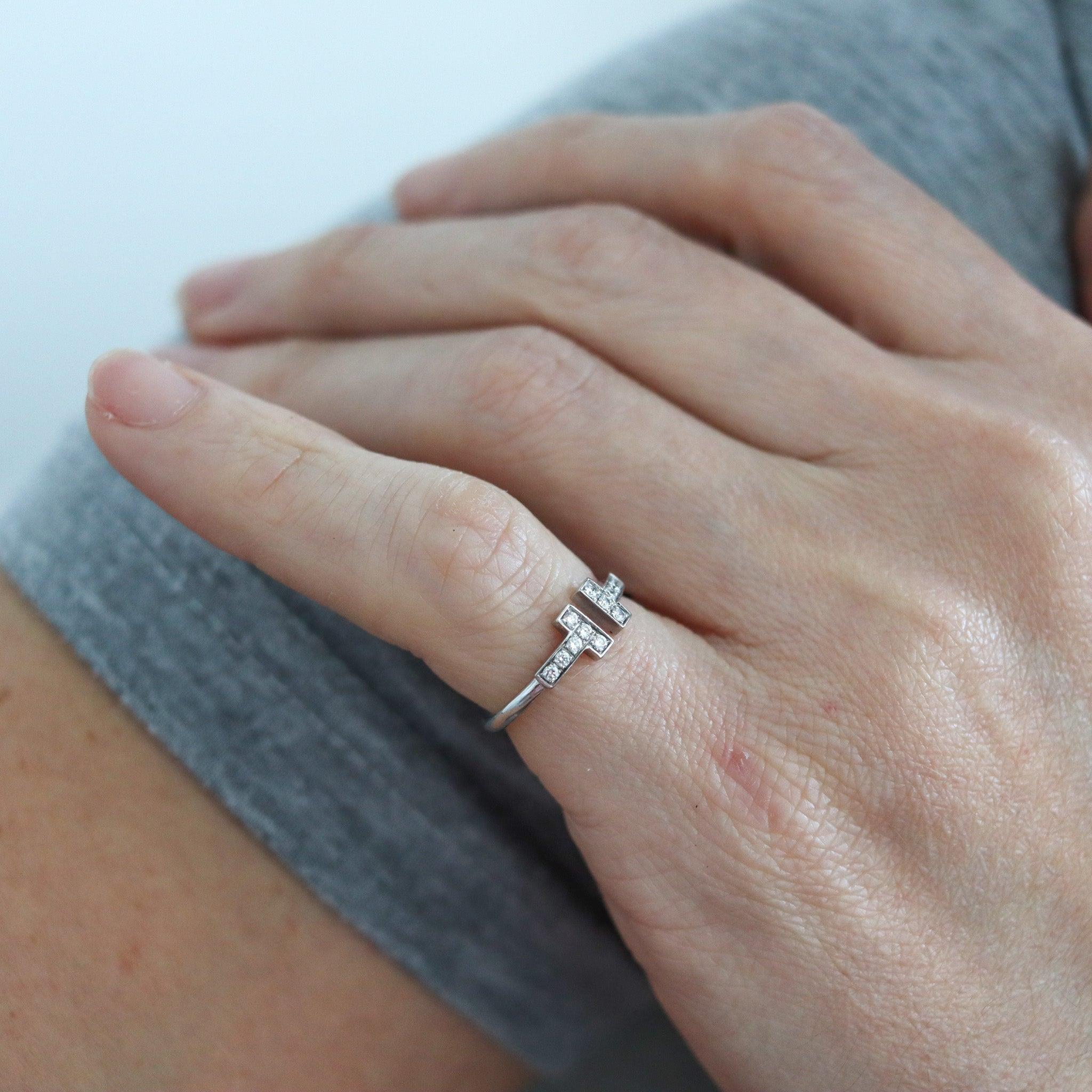 Double T wire ring designed by Cartier.

This is a beautiful T wire ring created by the jewelry house of Tiffany & Co, back in the 2000's. The iconic ring was carefully crafted in solid white gold of 18 karats with high polished finish, and