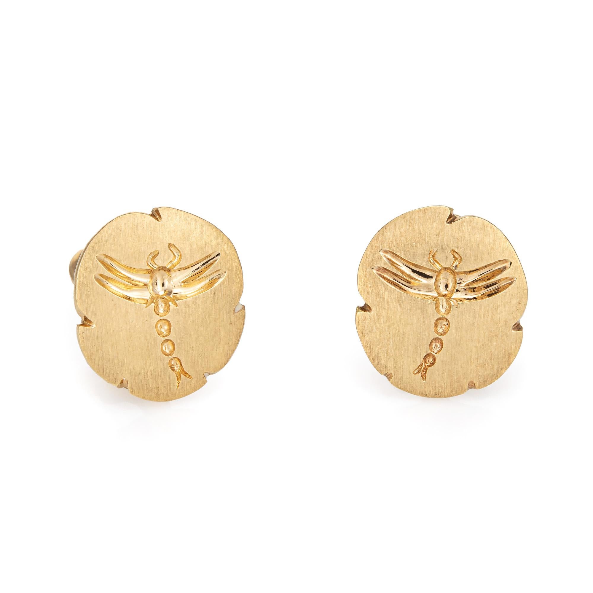 Finely detailed pair of vintage Tiffany & Co dragonfly earrings crafted in 18k yellow gold (circa 1980s). 

The dragonfly is a symbol of transformation, change and adaptability. The surface of the earrings features a satin finish with the