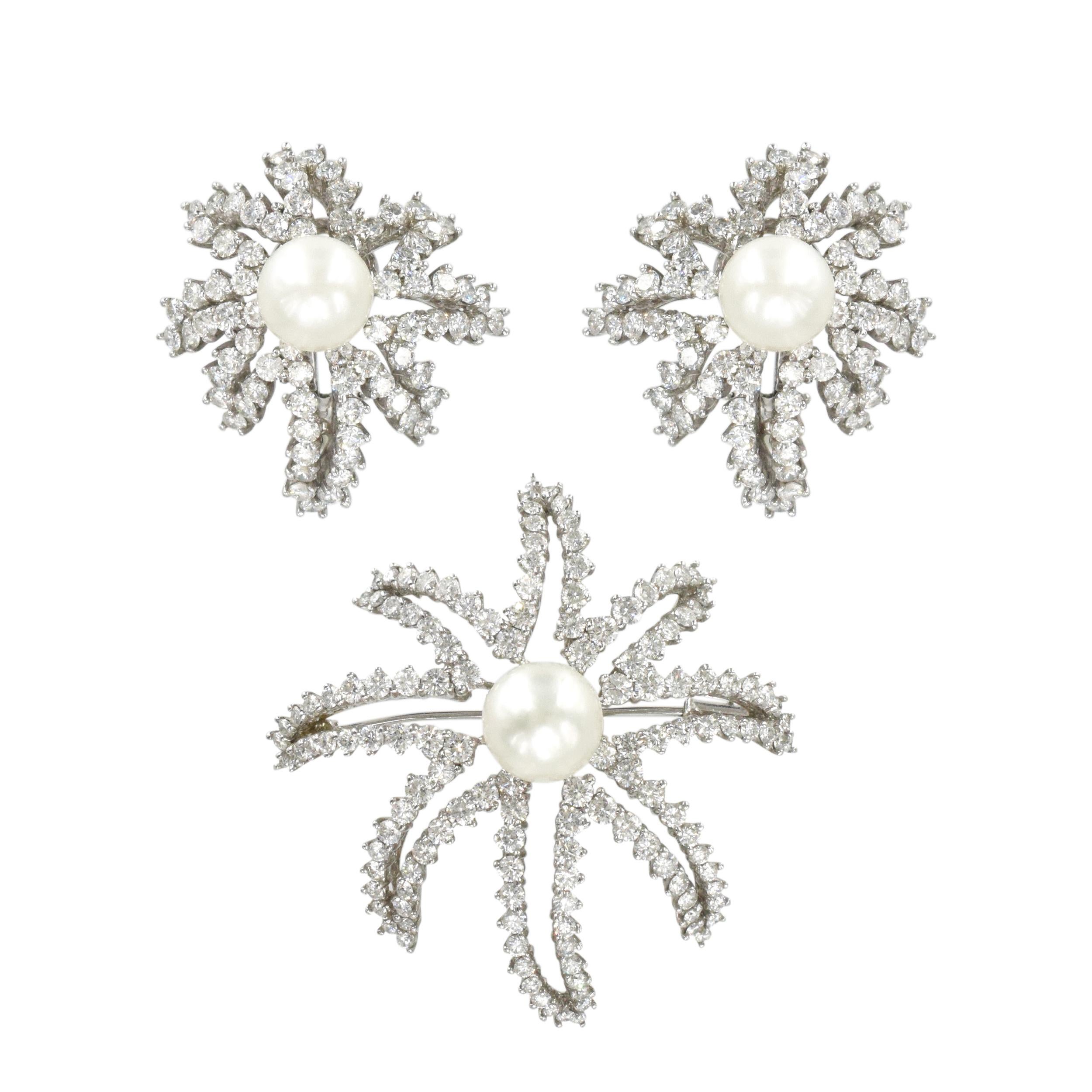 Tiffany & Co. pearl and diamond firework suite in platinum. Circa 1990's. The set consists of pair of open frame firework ear-clip earrings, set with 152 round brilliant cut diamonds with total weight of approximately 4.5 carats color F-G, clarity