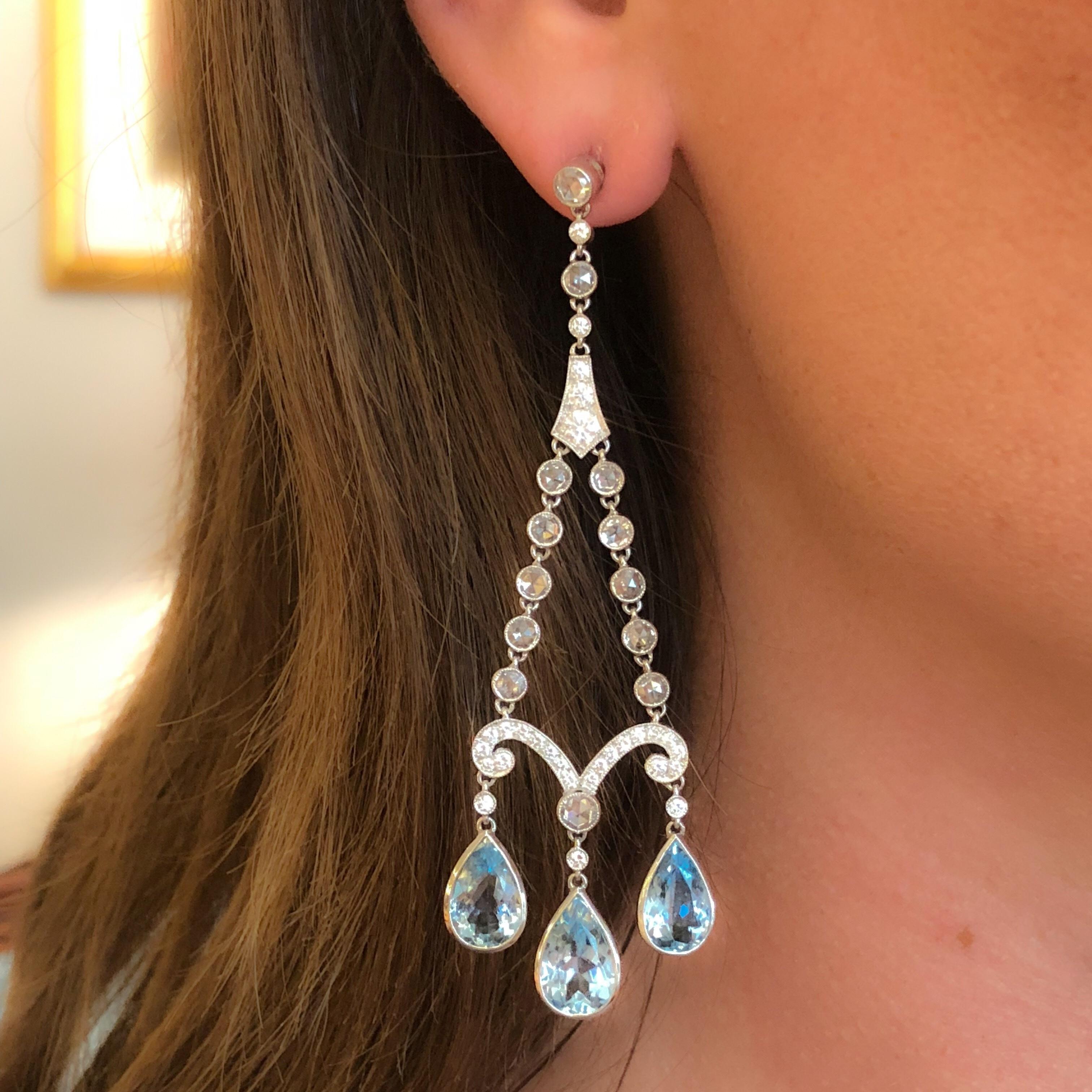 A pair of earrings with aquamarines and diamonds by Tiffany & Co. The earrings have 6 pear-shaped aquamarines with an approximate total weight of 10.00 carats, and 82 round and rose-cut diamonds with an approximate total weight of 4.00 carats with