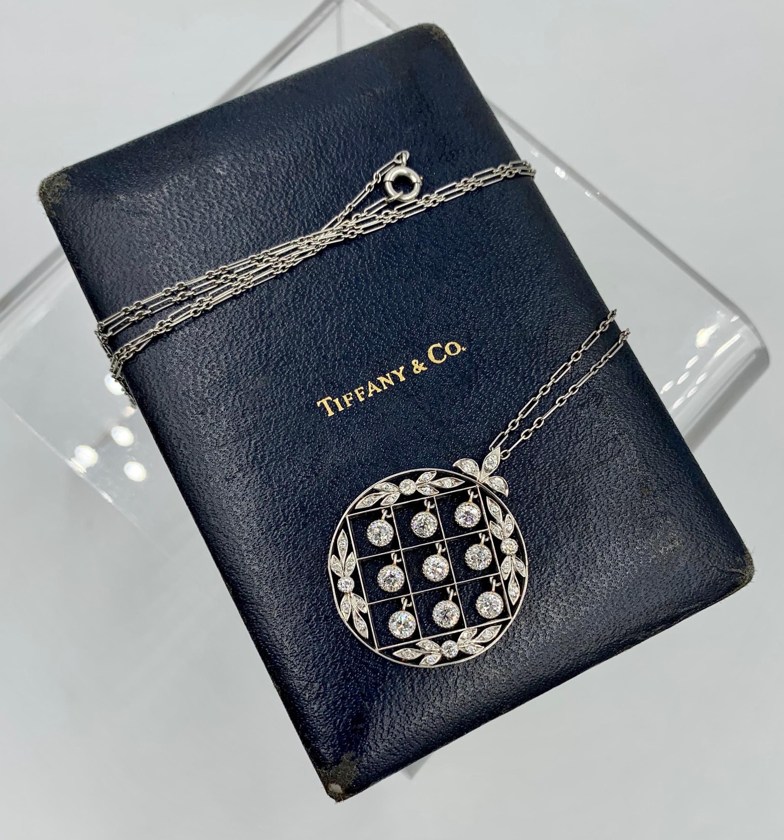 This is an extraordinary Tiffany & Co. Edwardian Pendant Necklace with over two Carats of magnificent Old Mine Cut Tiffany Diamonds set in Platinum in an open work drop dangle checkerboard motif with garland design accents.  The signed Tiffany & Co.