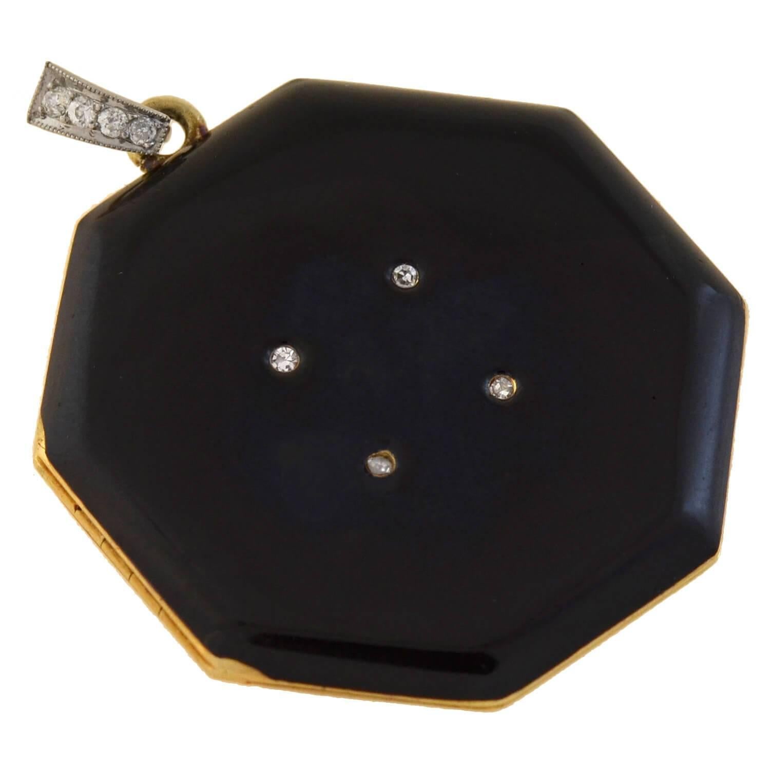 A gorgeous Edwardian era (ca1910) locket from legendary designer Tiffany & Co.! This octagonal-shaped piece is crafted in 14kt yellow gold and adorns glossy black enamel on both sides. Four single cut diamonds are set in a square formation at the