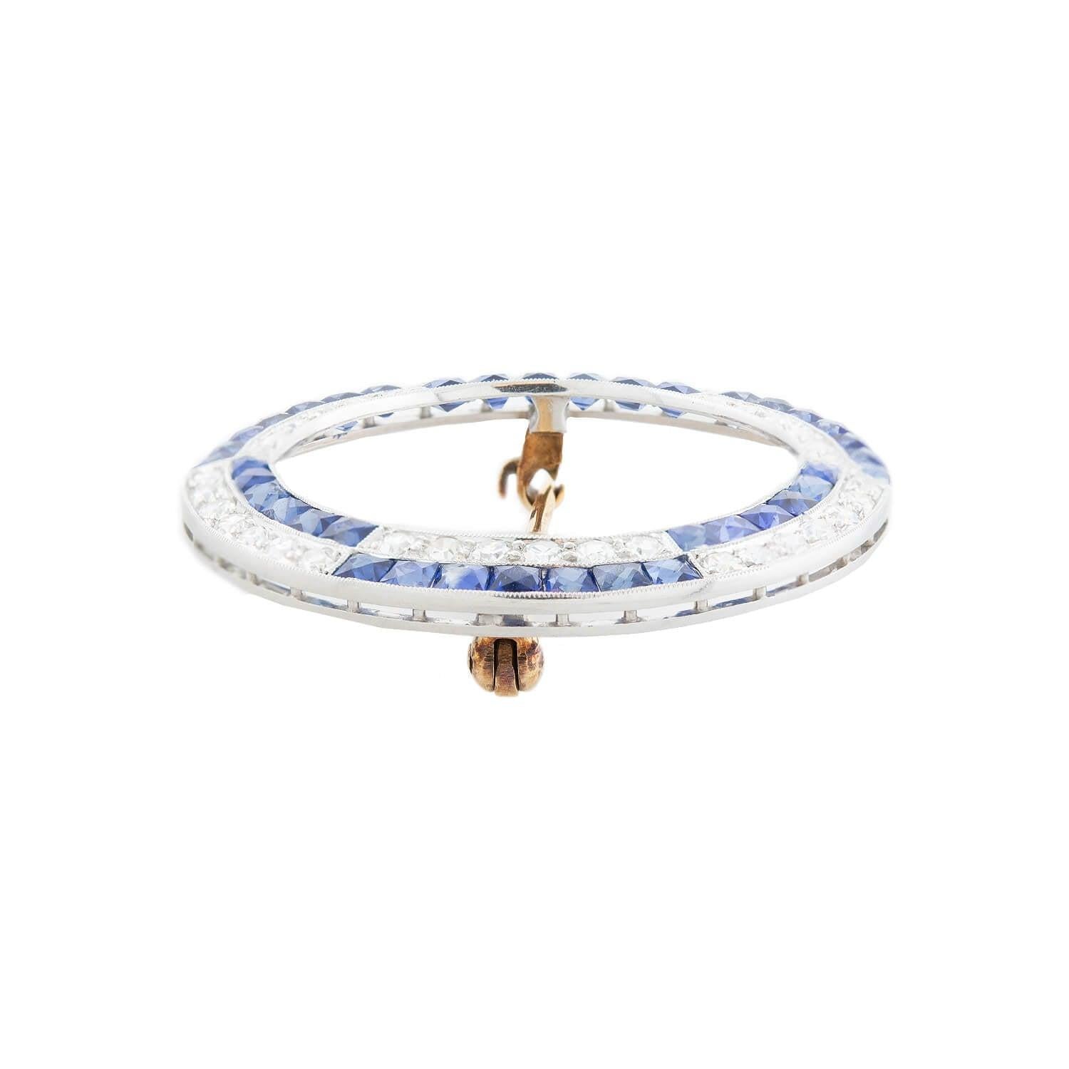 A timeless diamond and sapphire pin by famed maker Tiffany & Co.! Crafted in platinum, this gorgeous pin features 2ctw of glittering Single Cut diamonds and 1ctw of gorgeous French Cut sapphires. The diamonds and sapphires create an alternating