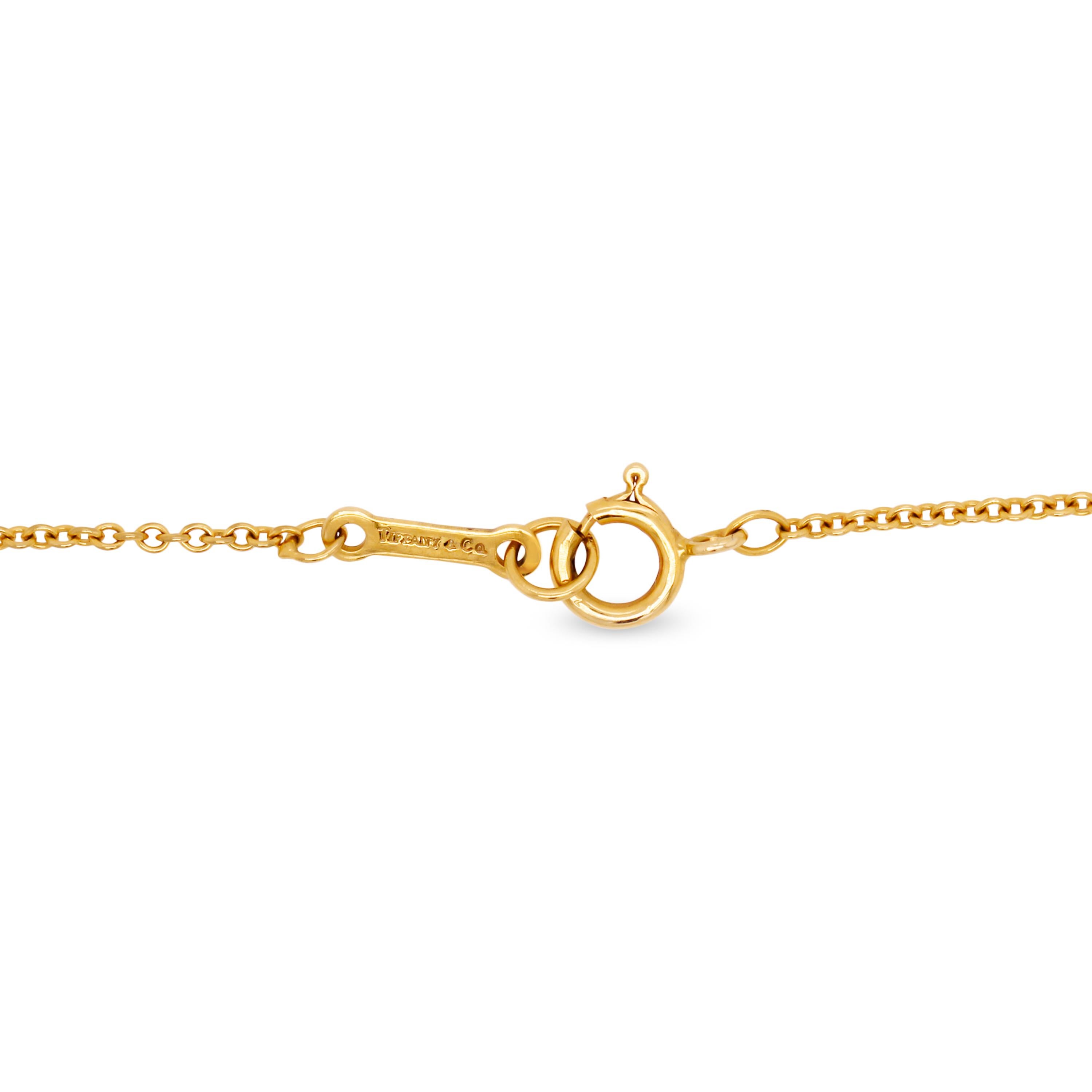 Tiffany & Co Elsa Peretti 18 Karat Gold Large Bean Pendant Necklace

18.5mm width of Bean. (0.75 inch).

Chain is 14 inches in length.

Signed Tiffany & Co. Peretti