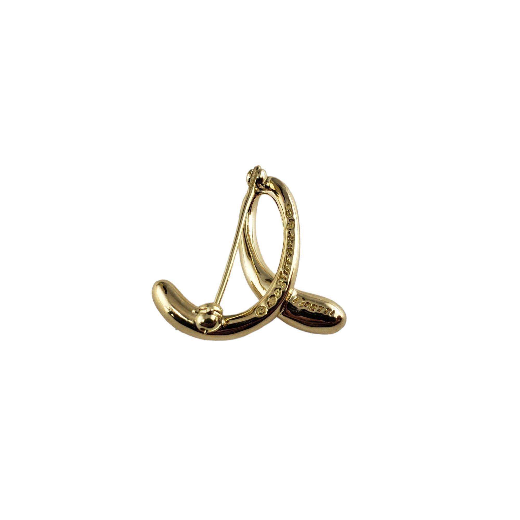 Tiffany & Co. Elsa Peretti Broche/pince « E » initiale en or jaune 18 carats en vente 1