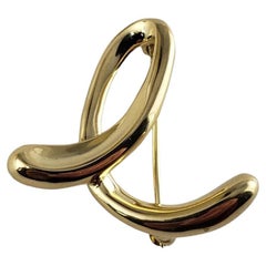 Tiffany & Co. Spilla/spilla con iniziale "E" in oro giallo 18 carati di Elsa Peretti