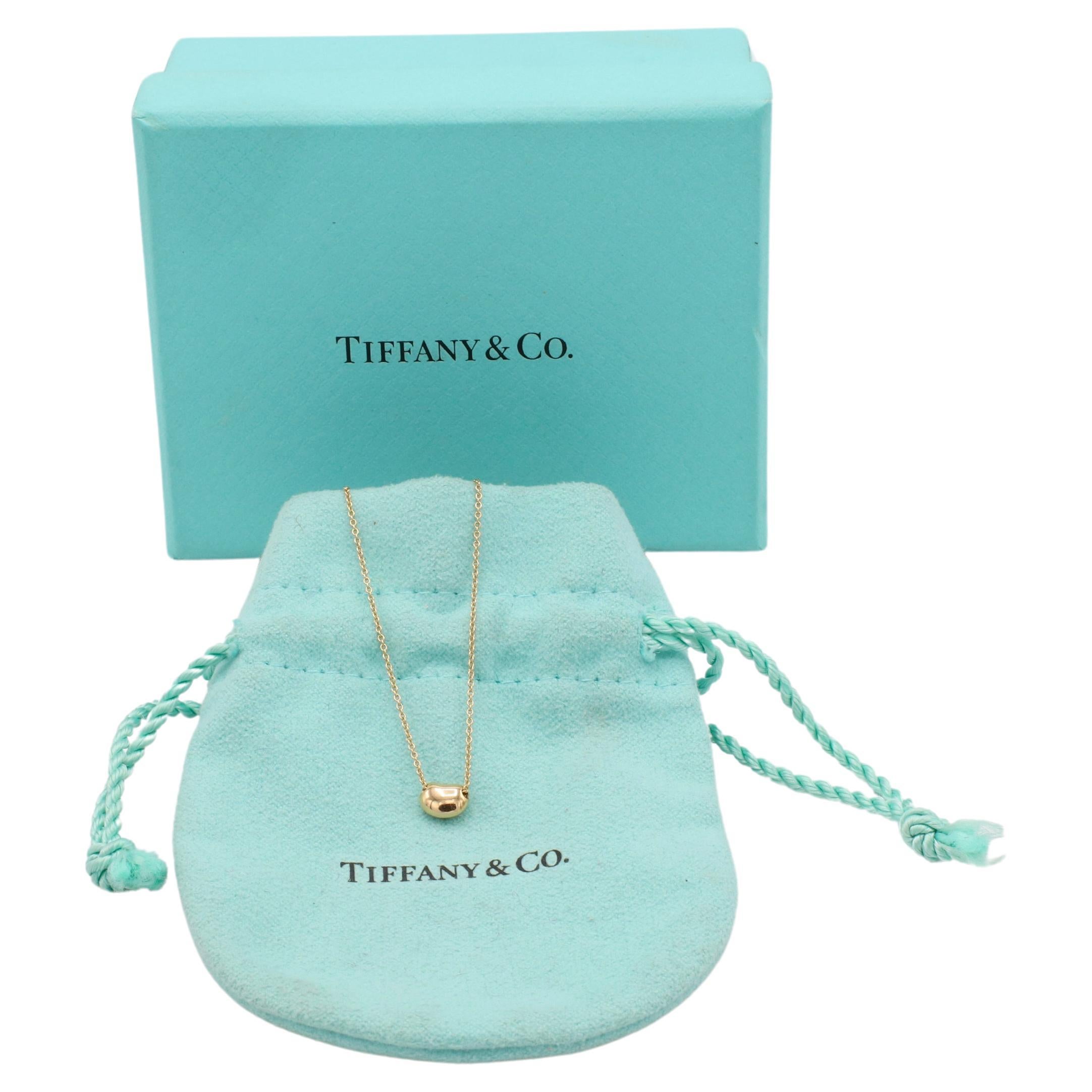 Tiffany & Co. Elsa Peretti 18 Karat Yellow Gold Mini Bean Pendant Necklace 6.5mm
Metal: 18k yellow gold
Weight: 1.86 grams
Bean: 6.5mm
Chain: 16 inch
Retail: $675 USD
Signed: Tiffany & Co. ©Peretti SPAIN Au750 