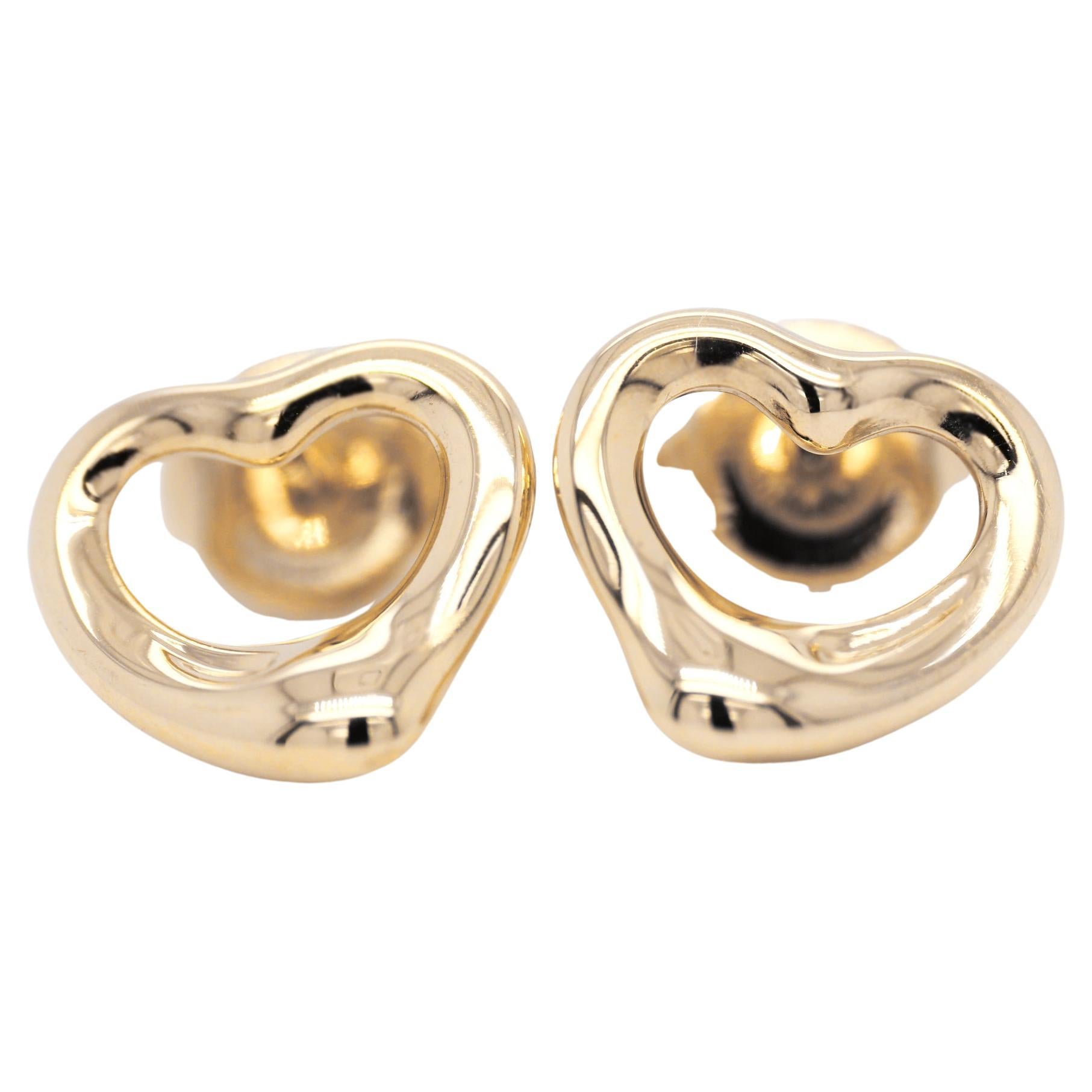 Polished 18ct yellow gold heart shaped earstuds by Elsa Peretti for Tiffany & Co.  Delicate and pretty.

Heart height: 10.7mm
Heart width: 10.7mm

Stamped on the underside: 'TIFFANY & CO.  @ Elsa Peretti  750  SPAIN'

Weight including butterfly