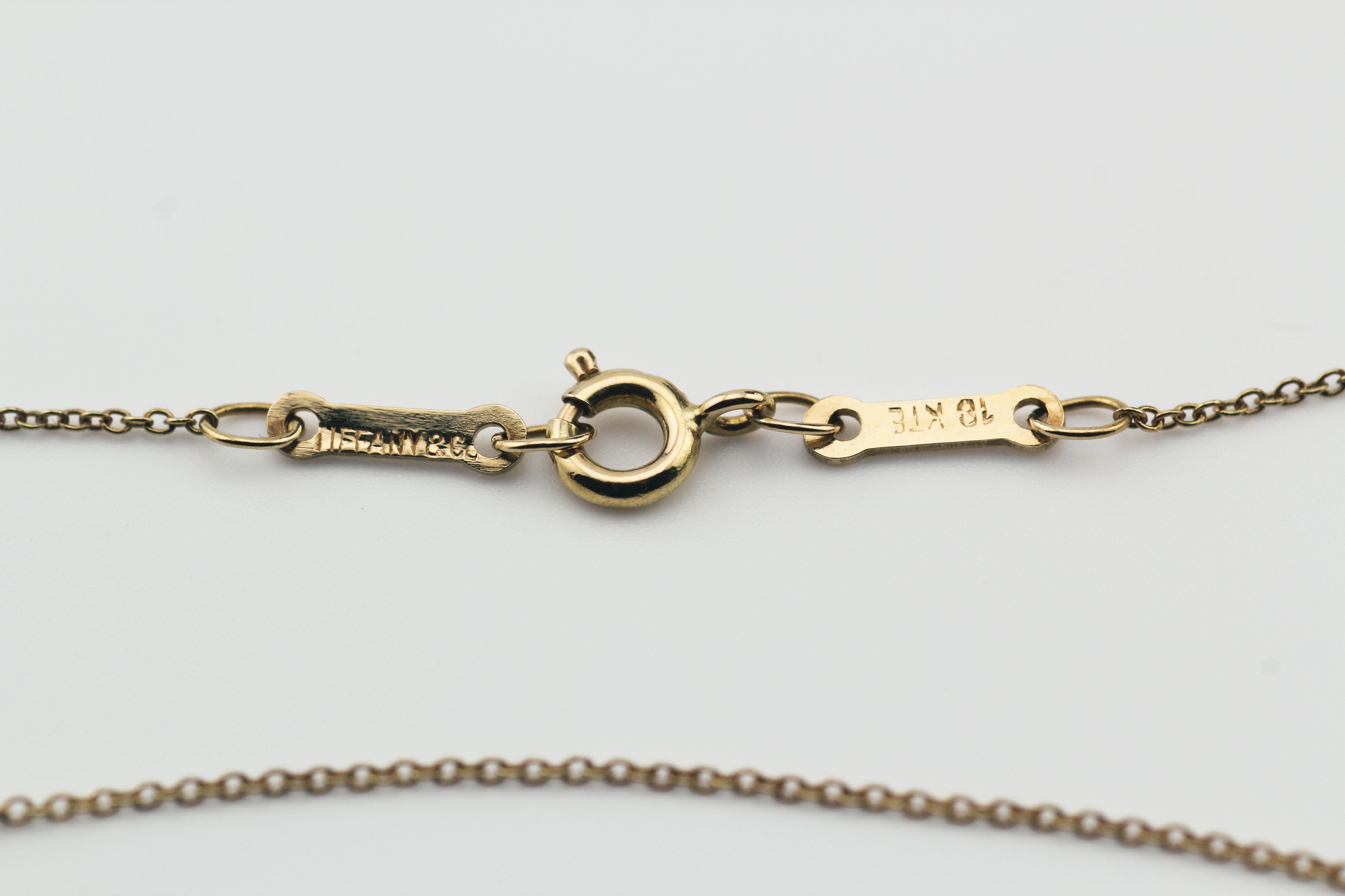 The Tiffany & Co. Elsa Peretti Star of David 18K Yellow Gold Necklace Pendant is a dazzling and meaningful piece of jewelry that beautifully combines iconic design with exquisite craftsmanship. This pendant is part of the celebrated Elsa Peretti