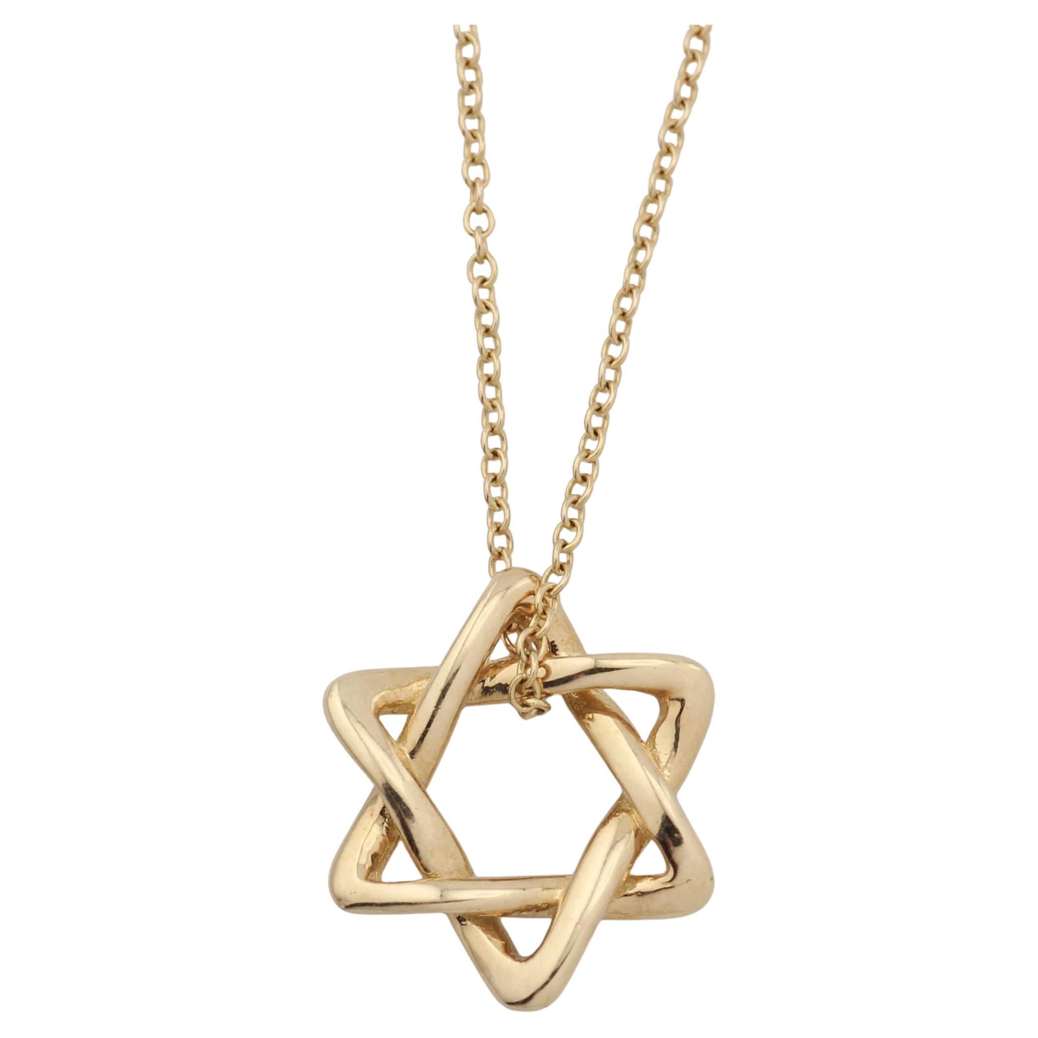 Tiffany
Co. Elsa Peretti 18K Gold 12mm Small Star of David Pendant Necklace