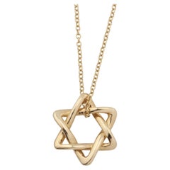 Tiffany
Co. Elsa Peretti 18K Gold 12mm Small Star of David Pendant Necklace