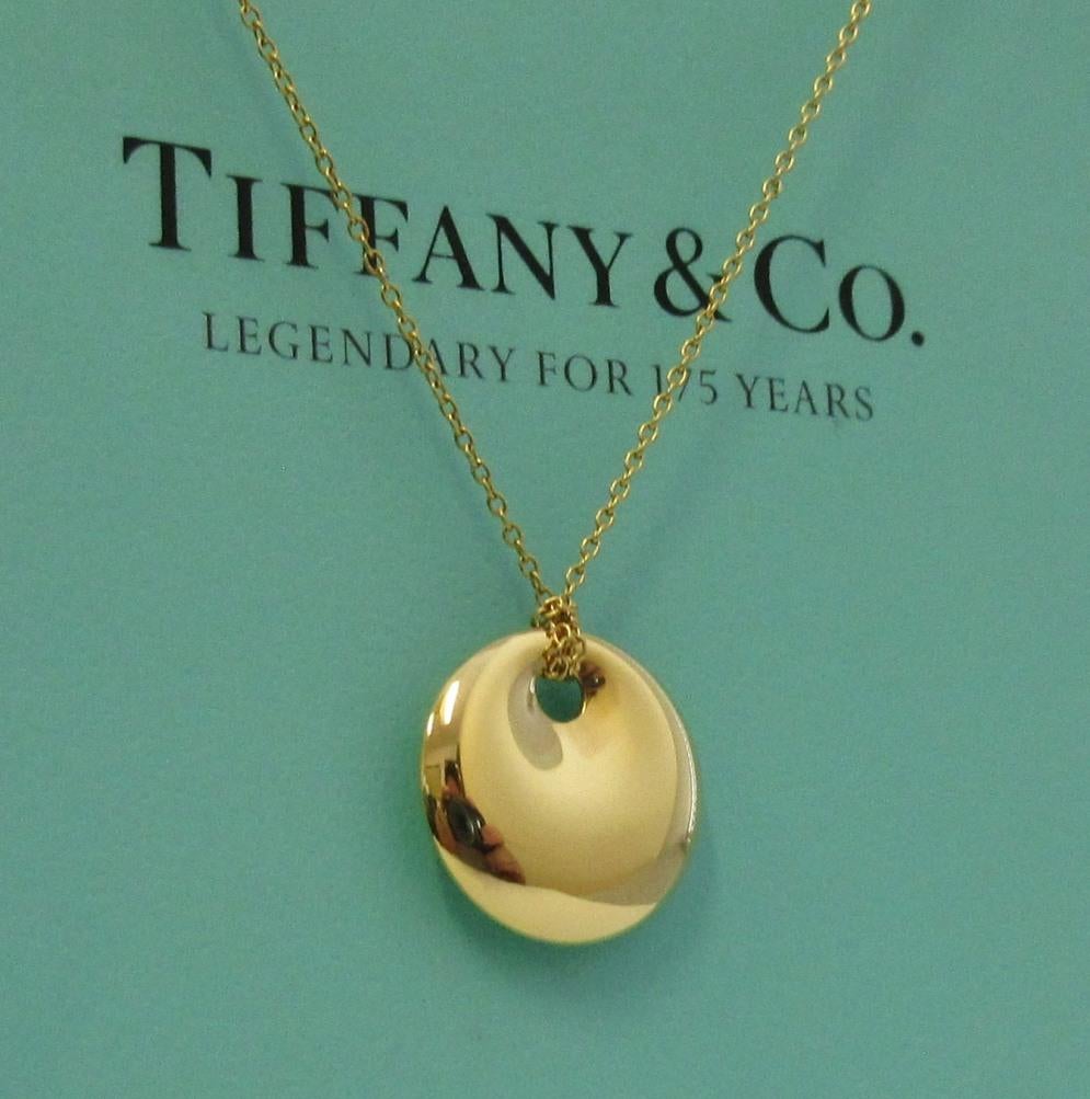TIFFANY & Co. Elsa Peretti 18K Gold 14mm Round Pendant Necklace

Metal: 18K Yellow Gold
Chain: 16