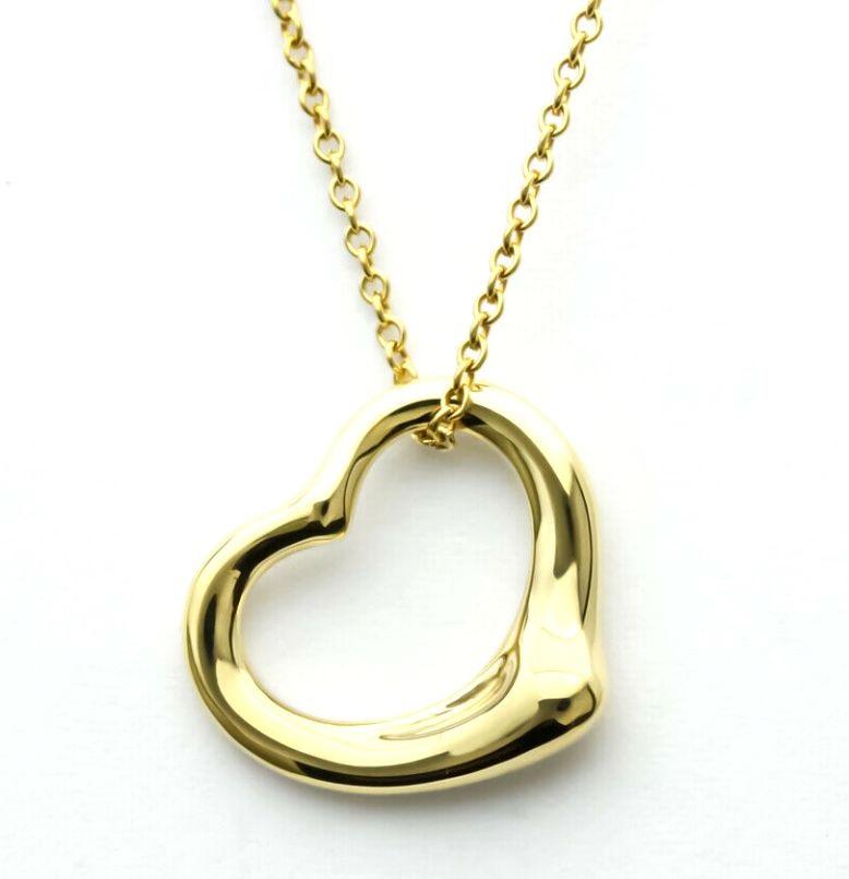 TIFFANY & Co. Elsa Peretti 18K Gold 16mm Open Heart Pendant Necklace

Metal: 18K Yellow Gold
Weight: 4.50 grams
Chain: 16