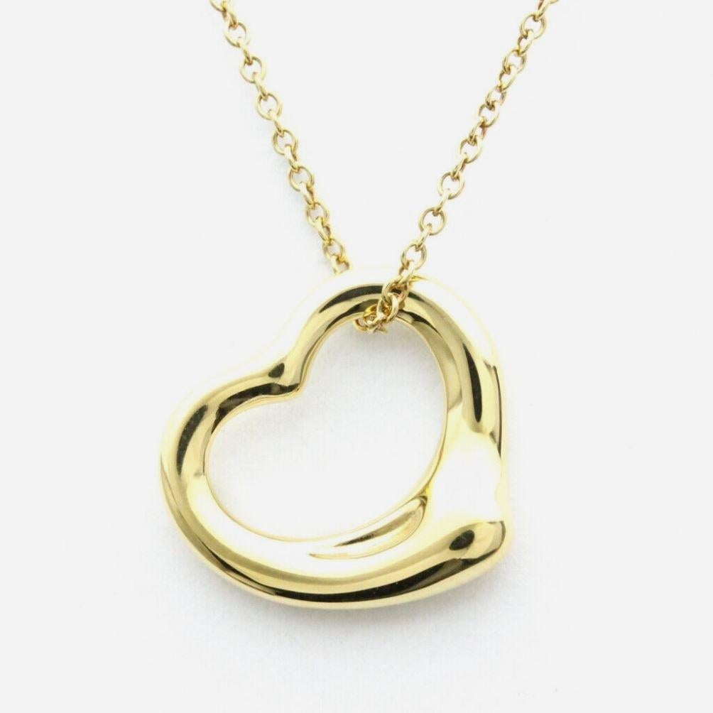 TIFFANY & Co. Elsa Peretti 18K Gold 16mm Open Heart Pendant Necklace

Metal: 18K Yellow Gold
Weight: 4.30 grams
Chain: 16
