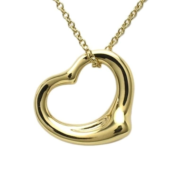TIFFANY & Co. Collana con ciondolo a cuore aperto Elsa Peretti in oro 18 carati da 16 mm

Metallo: Oro giallo 18 carati
Peso: 4,40 grammi
Catena: 16