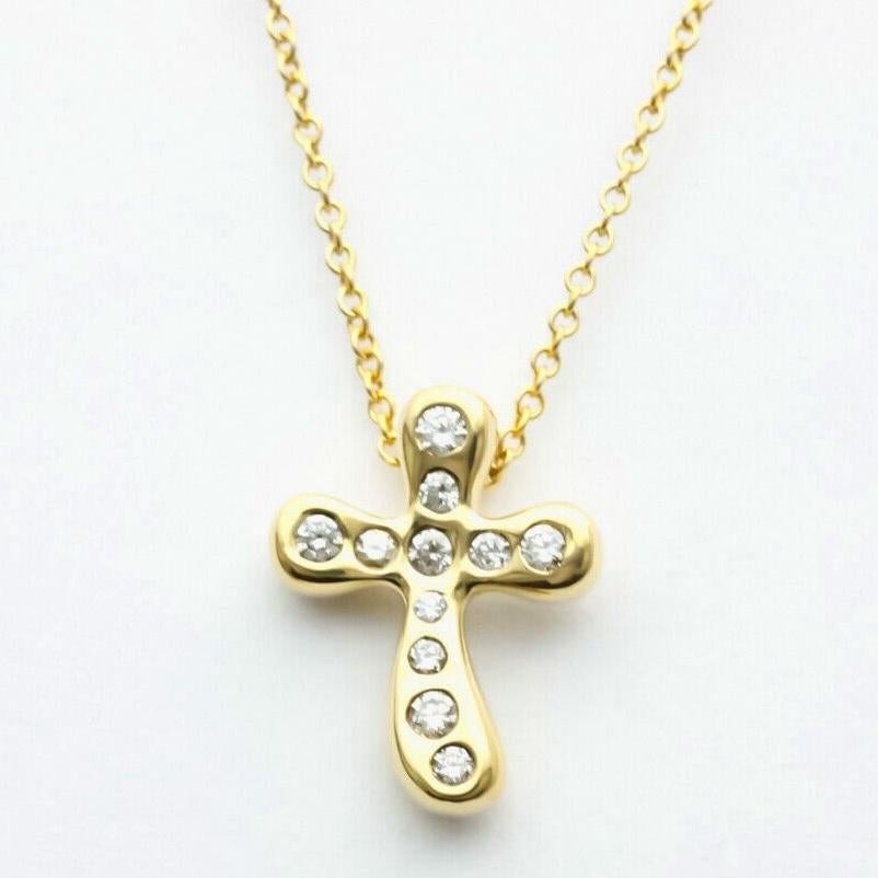 TIFFANY & Co. Elsa Peretti Collier pendentif croix en or 18K avec diamant de 0,20ct 

Métal : or jaune 18K
Poids : 4.20 grammes 
Chaîne : 16