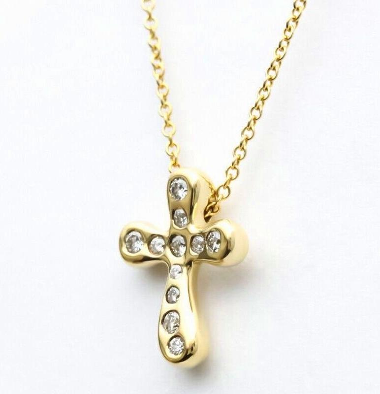 Round Cut TIFFANY & Co. Elsa Peretti 18K Gold .20ct Diamond Cross Pendant Necklace For Sale