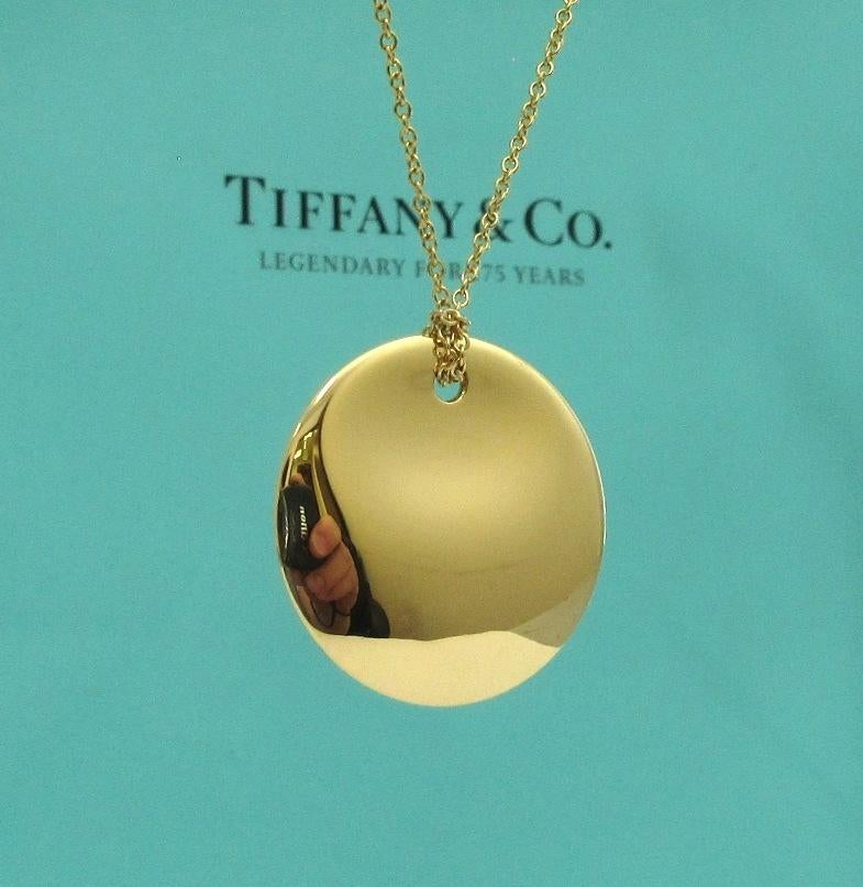 TIFFANY & Co. Elsa Peretti 18K Gold 24mm Round Pendant Necklace

Metal: 18K Yellow Gold
Chain: 16