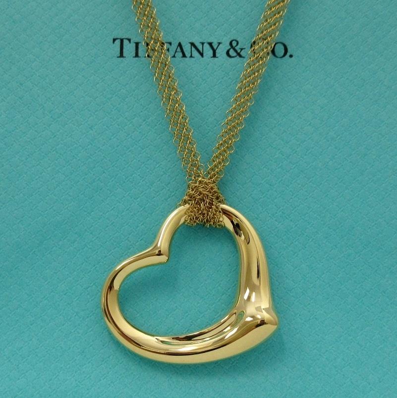 TIFFANY & Co. Elsa Peretti 18K Gold 36mm Open Heart Pendant Mesh Chain Necklace

The simple, evocative shape of Elsa Peretti Open Heart designs celebrates the spirit of love. This elegant creation is one of her most celebrated icons.

Metal: 18K