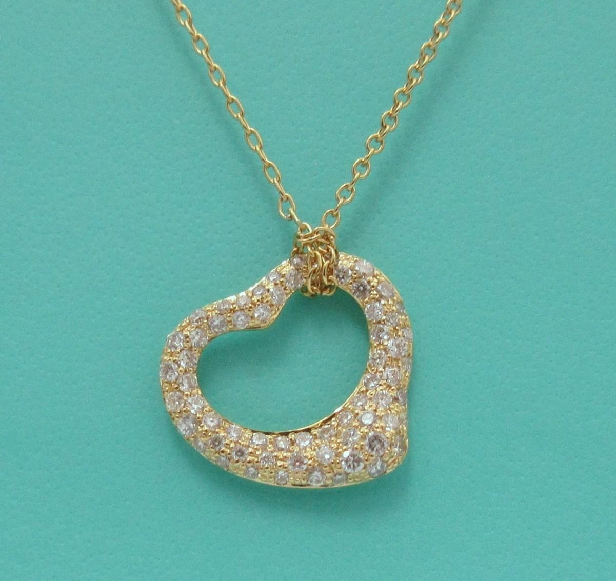 TIFFANY & Co. Elsa Peretti 18K Gold .40ct Diamond Open Heart Pendant Necklace 

Metal: 18K Yellow Gold 
Chain: 16