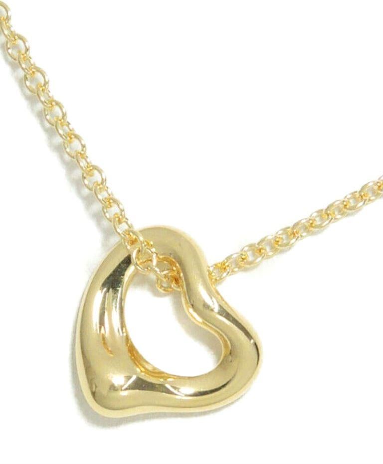 TIFFANY & Co. Elsa Peretti 18K Gold 7mm Open Heart Pendant Necklace

Metal: 18K Yellow Gold
Chain: 16