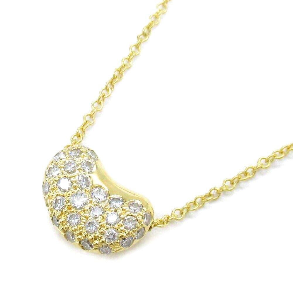 TIFFANY & Co. Elsa Peretti, collier pendentif Bean 11 mm en or 18 carats et diamants 

Métal : or jaune 18K 
Chaîne : 16
