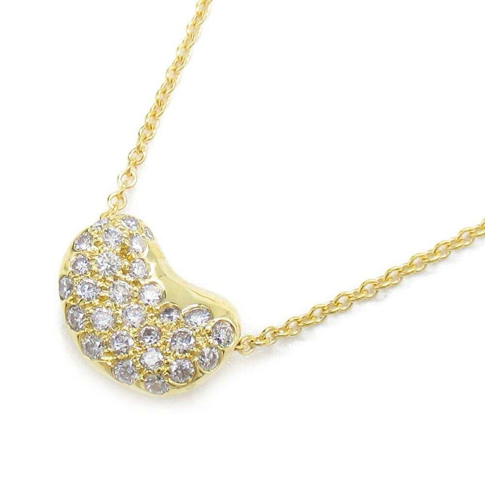 TIFFANY & Co. Elsa Peretti 18K Gold Diamond 11mm Bean Pendant Necklace 

Metal: 18K yellow gold 
Chain: 16