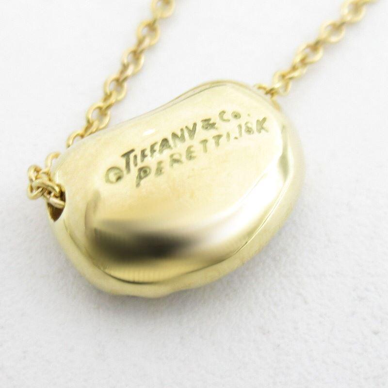 Women's TIFFANY & Co. Elsa Peretti 18K Gold Diamond 11mm Bean Pendant Necklace For Sale