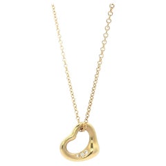 Tiffany 
Co. Elsa Peretti 18k Gold Diamond 11mm Open Heart Pendant Necklace