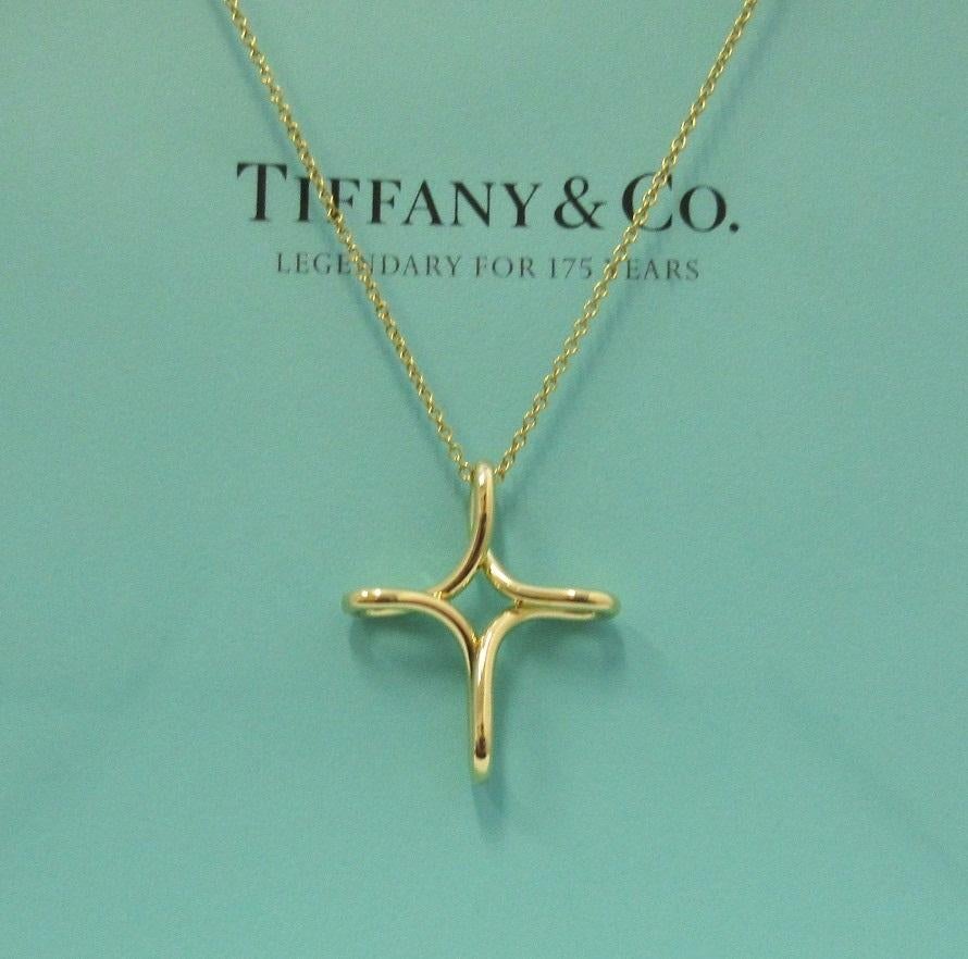 TIFFANY & Co. Elsa Peretti 18K Gold Infinity Cross Pendant Necklace Medium  

Metal: 18K yellow gold
Weight: 4.70 grams 
Chain: 16