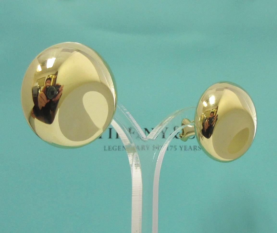 TIFFANY & Co. Elsa Peretti 18 Karat Gold Ohrringe mit Daumendruck 

Metall: 18K Gelbgold 
Gewicht: 16,20 Gramm 
Maße: 23,5 mm (0,93