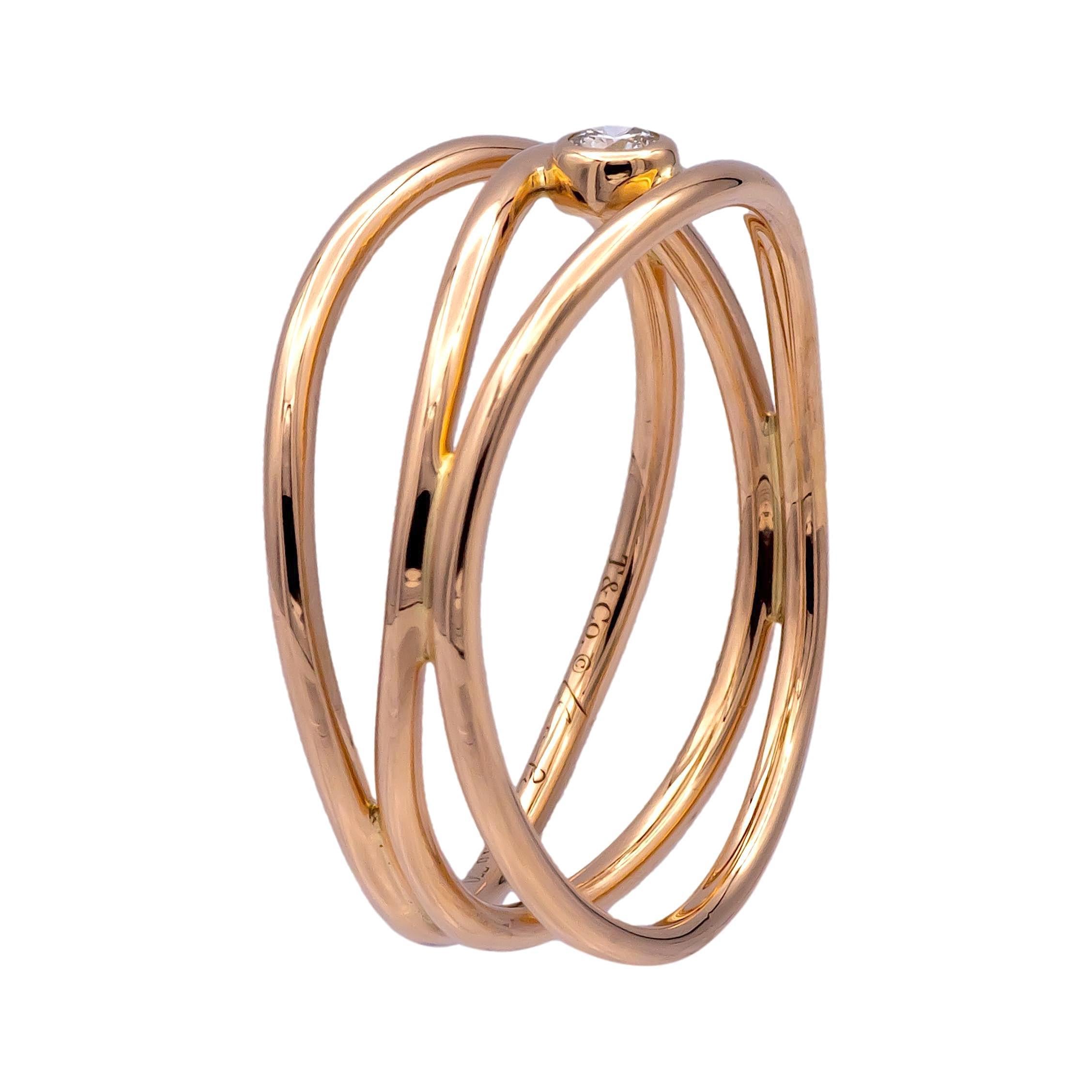 This pre-owned Elsa Peretti 3 Row Wave Ring is crafted in 18K pink gold and features a single round brilliant-cut diamond weighing approx .05cts. The design, characteristic of Elsa Peretti’s minimalist yet organic style, consists of three fluid,
