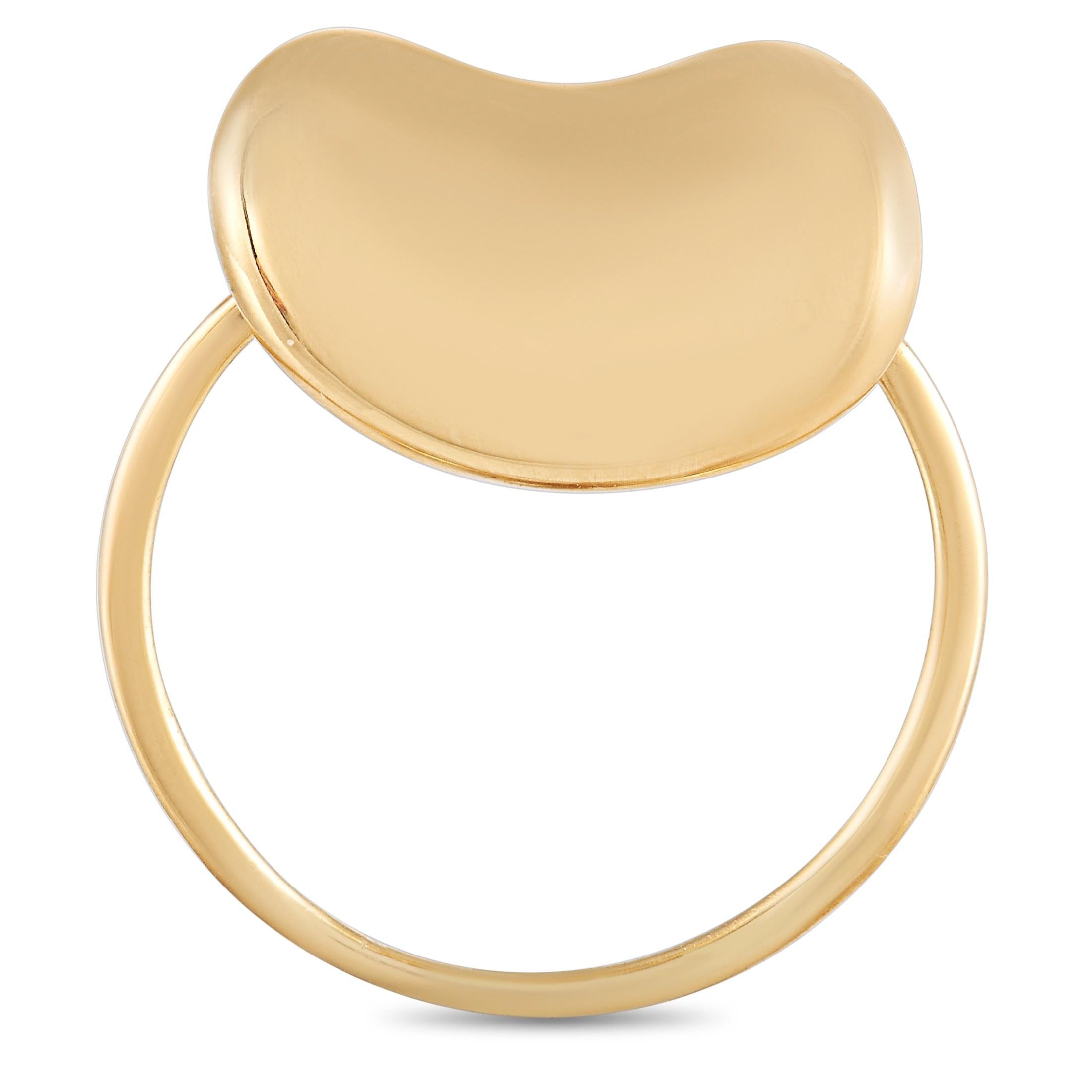 This sleek Tiffany & Co. ring by Elsa Peretti is a must-have for any lover of Tiffany’s! The ring is made with 18K yellow gold forming the band and the iconic Elsa Peretti Bean. The ring has a band thickness of 1 mm, a top height of 8 mm, top
