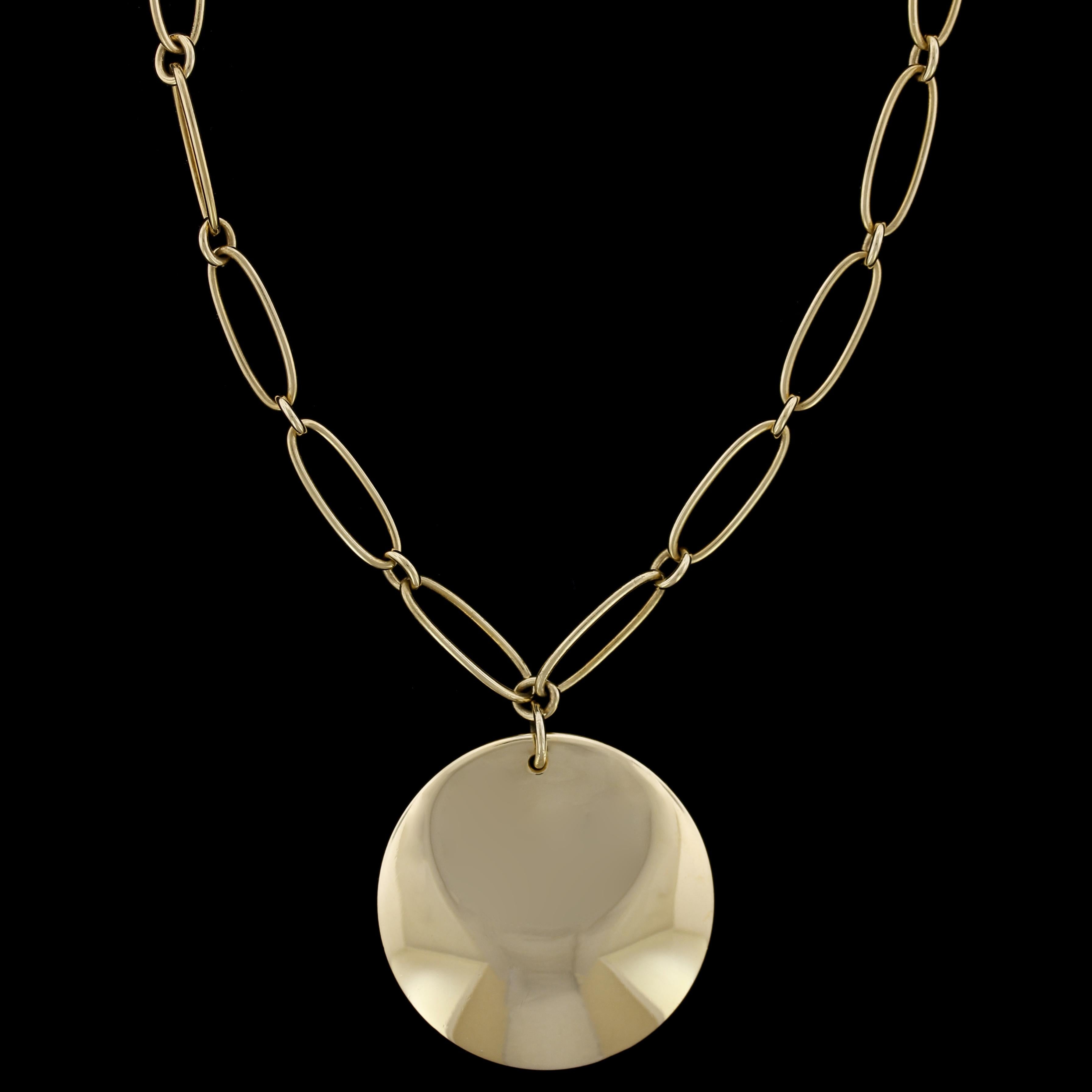 Tiffany & Co. Elsa Peretti 18K Yellow Gold Circle Pendant Necklace. The circle pendant
measures 30.00mm., suspended from a 16