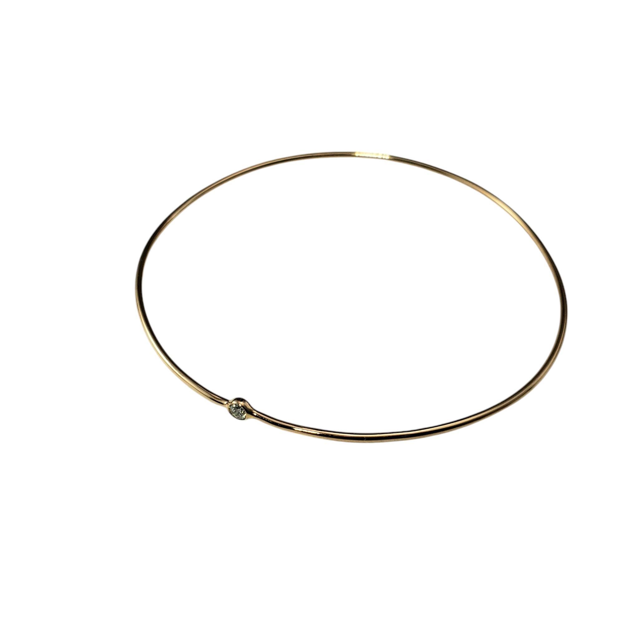 Tiffany & Co. Elsa Peretti 18K Yellow Gold and Diamond Bangle Bracelet

This sleek and modern bracelet exemplifies linear beauty, offering a minimalist yet elegant look. Designed by Elsa Peretti for Tiffany & Co., this bangle features one round