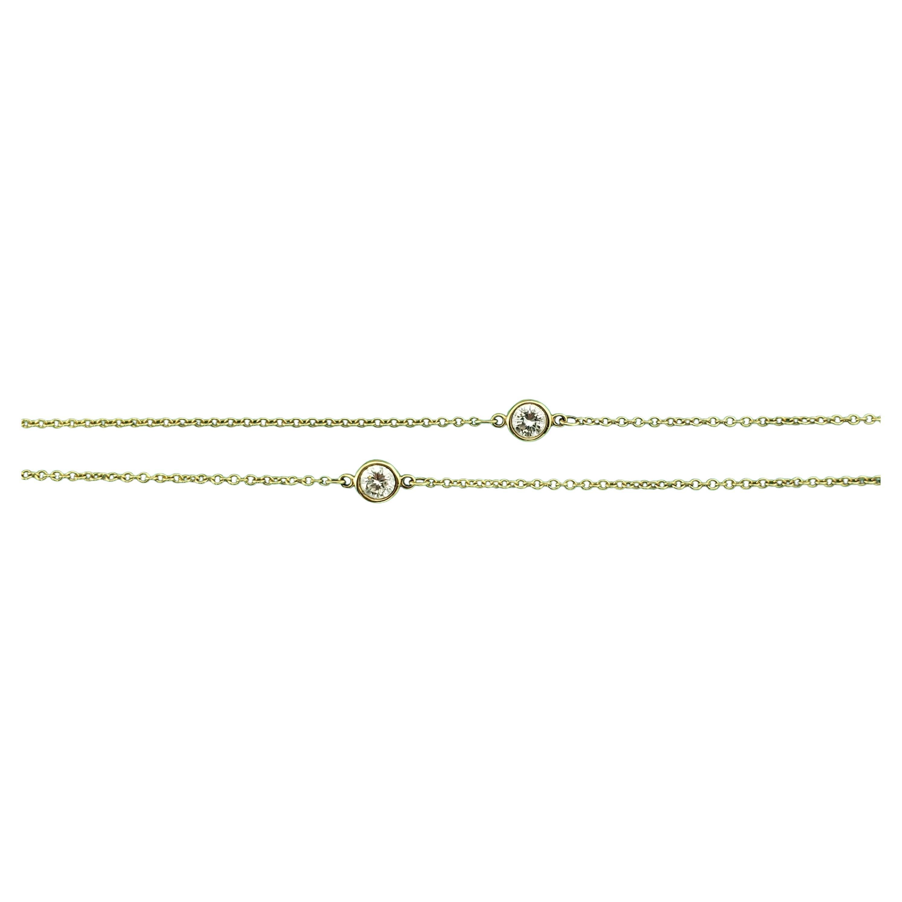Tiffany & Co. Elsa Peretti 18K Yellow Gold Diamonds by the Yard Necklace

This stunning station necklace features five round brilliant cut diamonds set in classic 18K yellow gold.  By Elsa Peretti for Tiffany & Co.

Approximate total diamond weight:
