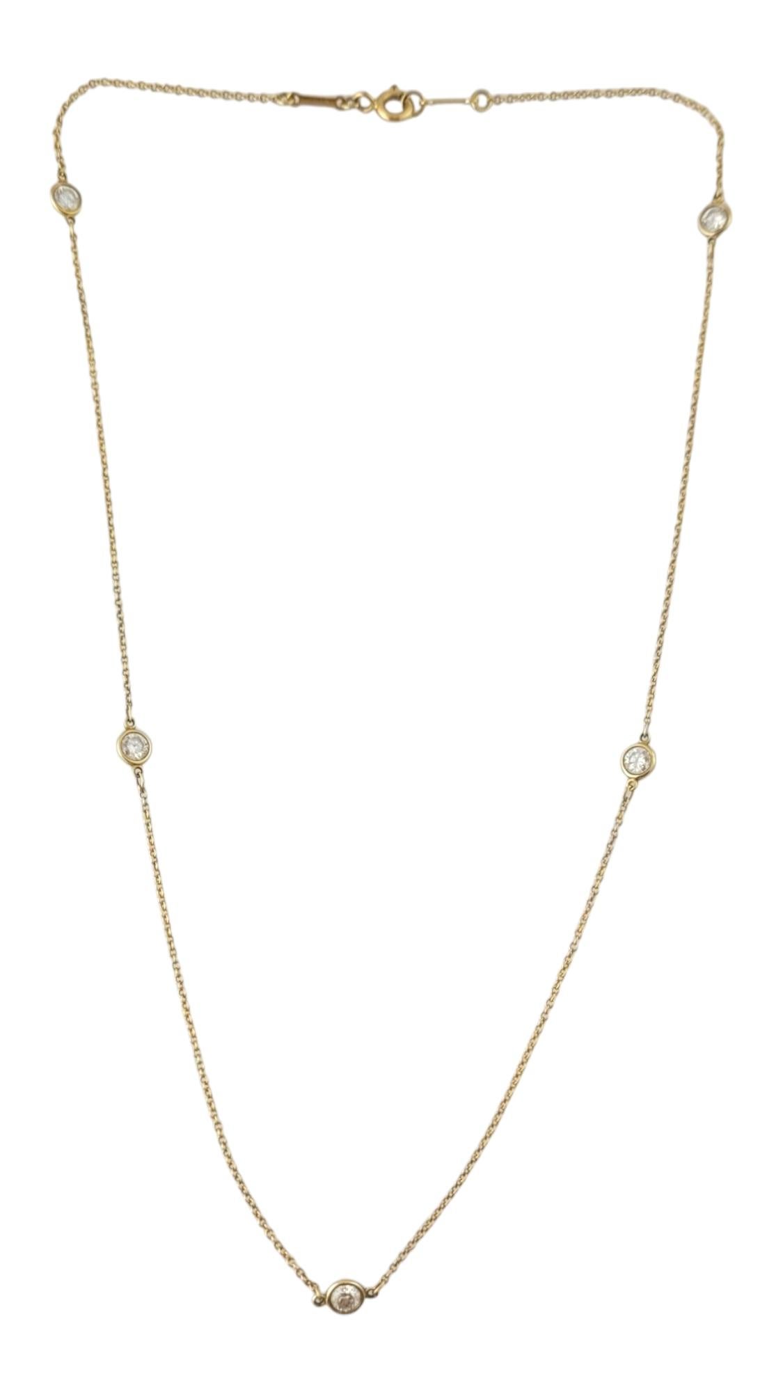 Tiffany & Co. Elsa Peretti 18K Yellow Gold Diamonds by the Yard Necklace

This stunning station necklace features five round brilliant cut diamonds set in classic 18K yellow gold.  By Elsa Peretti for Tiffany & Co.

Approximate total diamond weight: