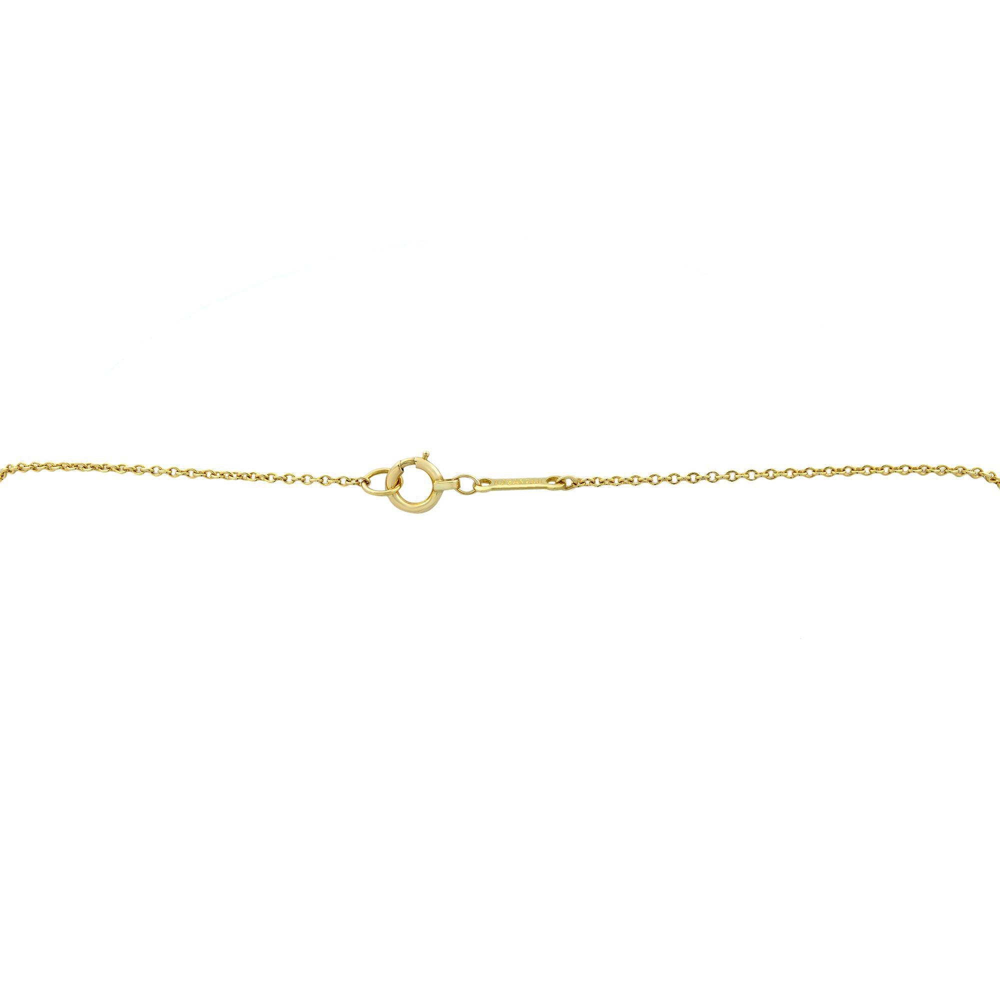 Modern Tiffany & Co. Elsa Peretti 18 Karat Yellow Gold Diamond Cross Pendant 0.25 Carat