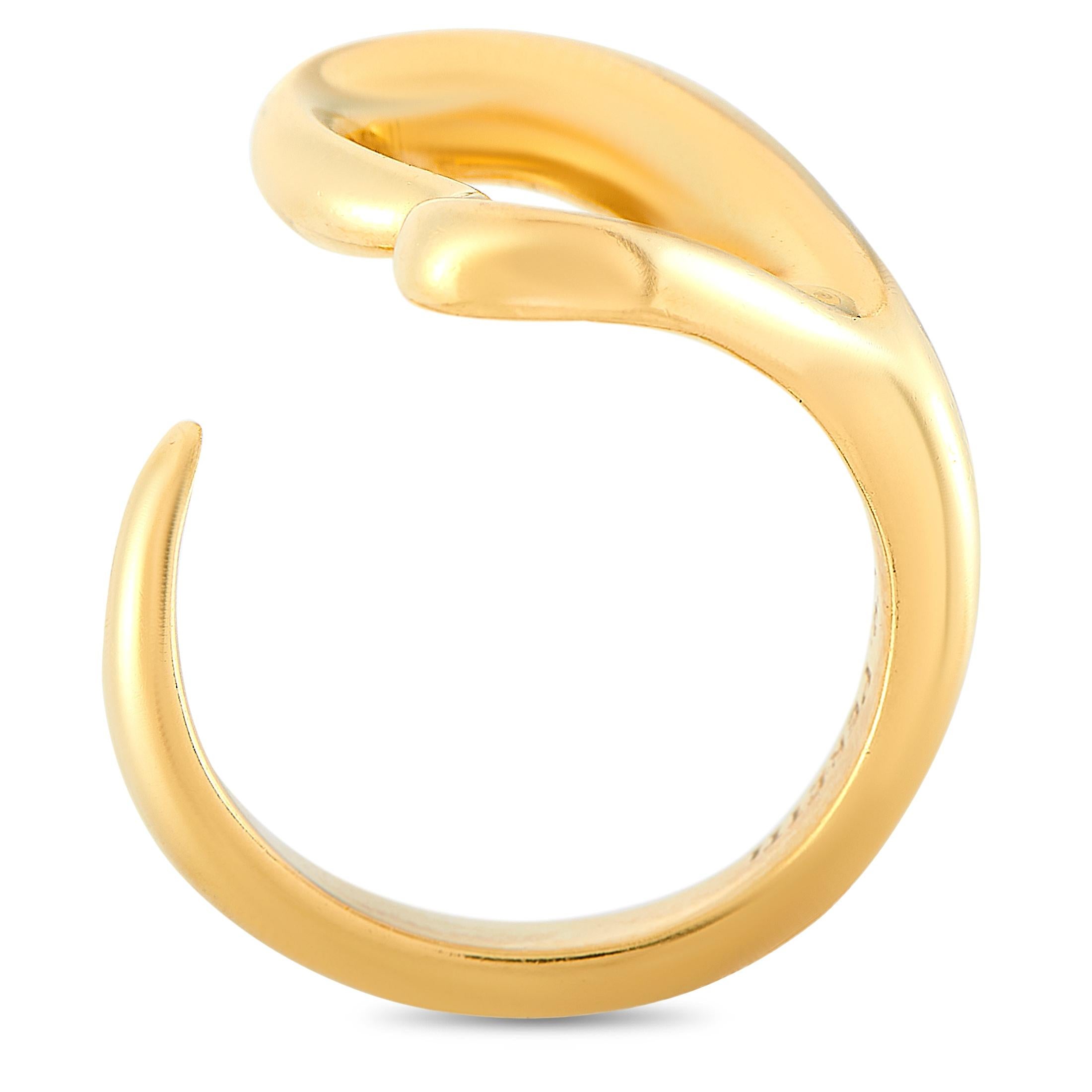 The Tiffany & Co. Elsa Peretti ring is crafted from 18K yellow gold and weighs 8.8 grams. The ring boasts band thickness of 3 mm and top height of 3 mm, while top dimensions measure 15 by 18 mm.

This item is offered in estate condition and includes