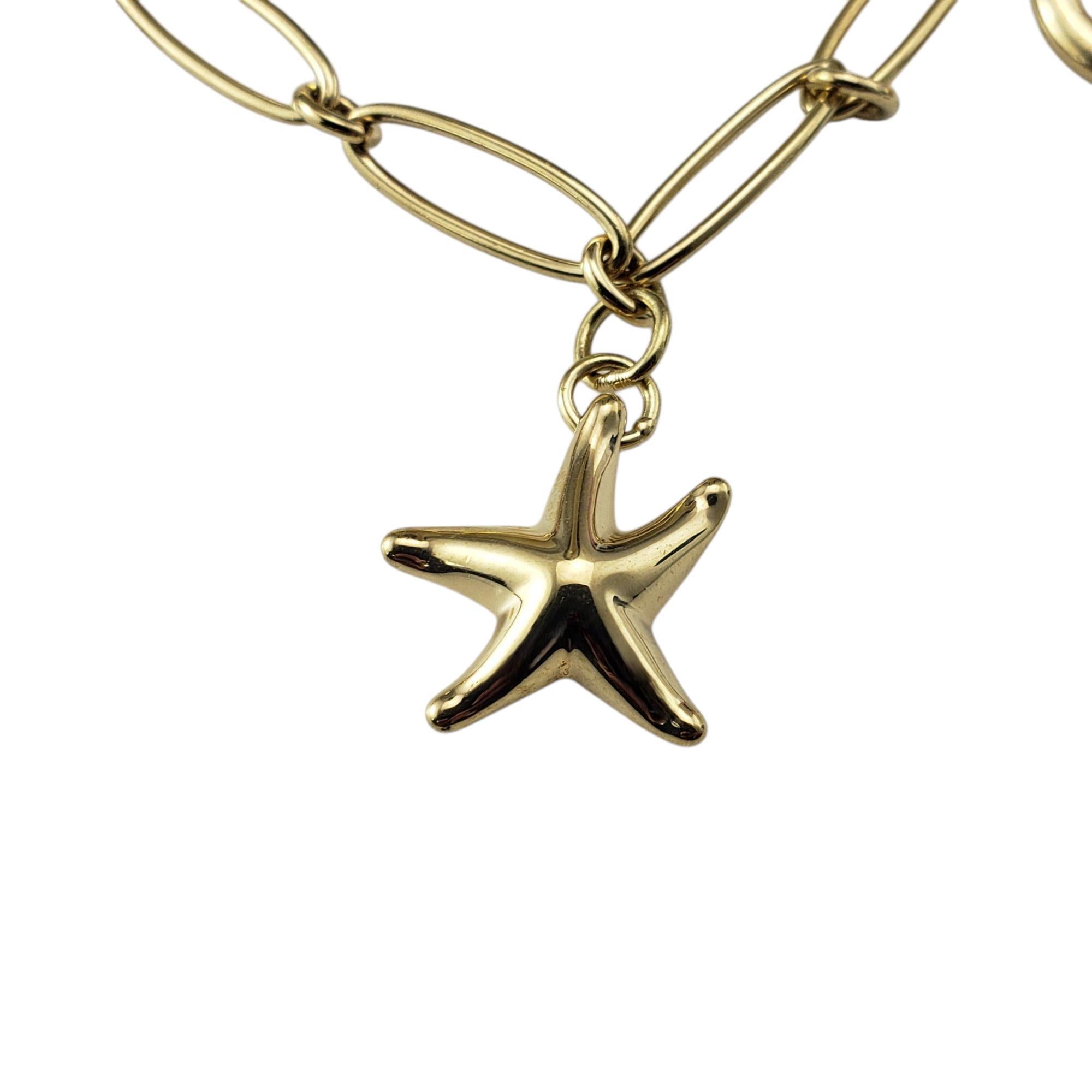 Tiffany & Co. Elsa Peretti - Bracelet à breloques Icone en or jaune 18K

Ce superbe bracelet à breloques en or jaune 18 carats de Tiffany & Co. présente cinq des designs les plus emblématiques d'Elsa Peretti : l'étoile de mer, le cœur ouvert, le